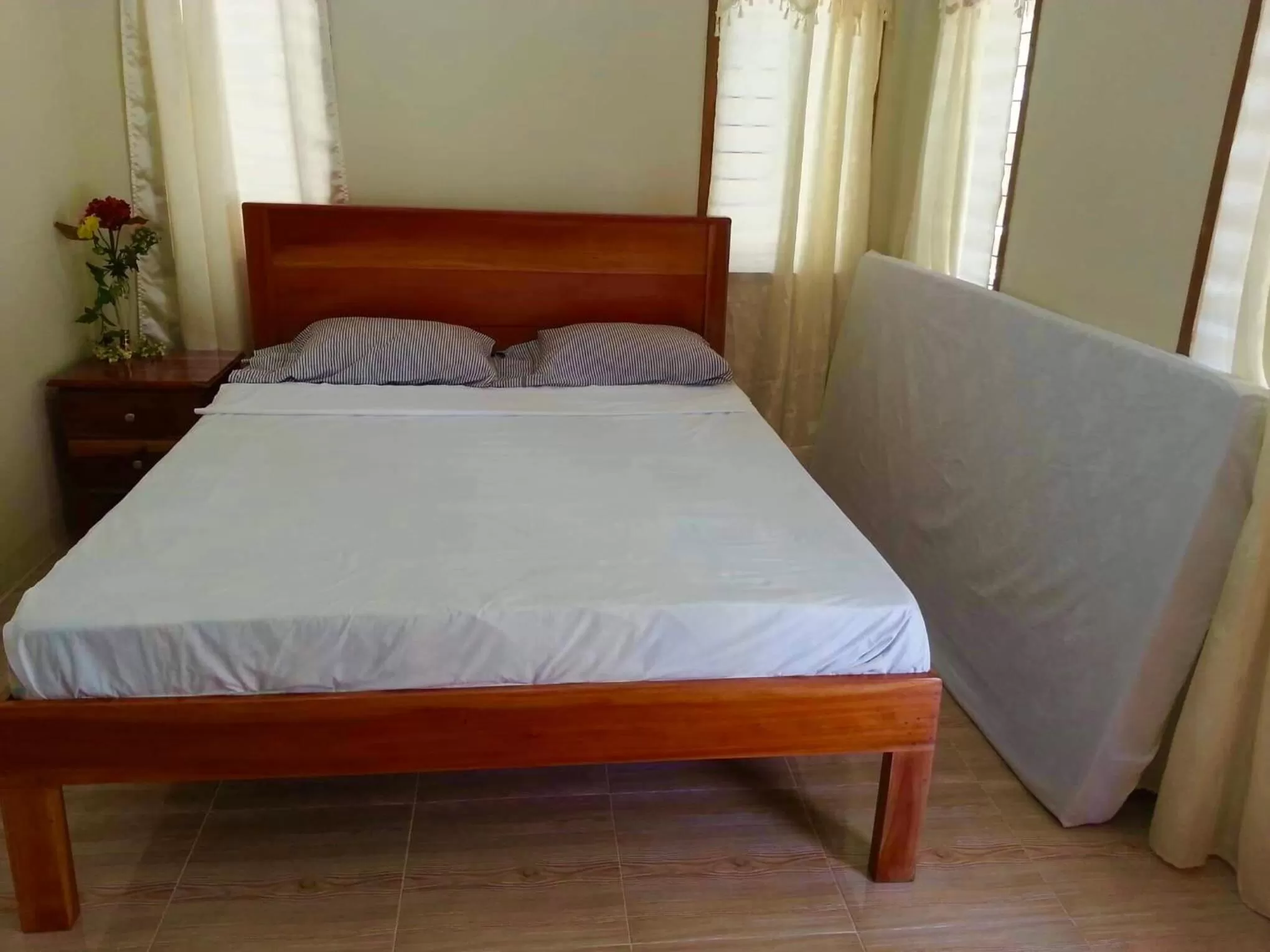 Bed in D's Oceanview Beach Resort