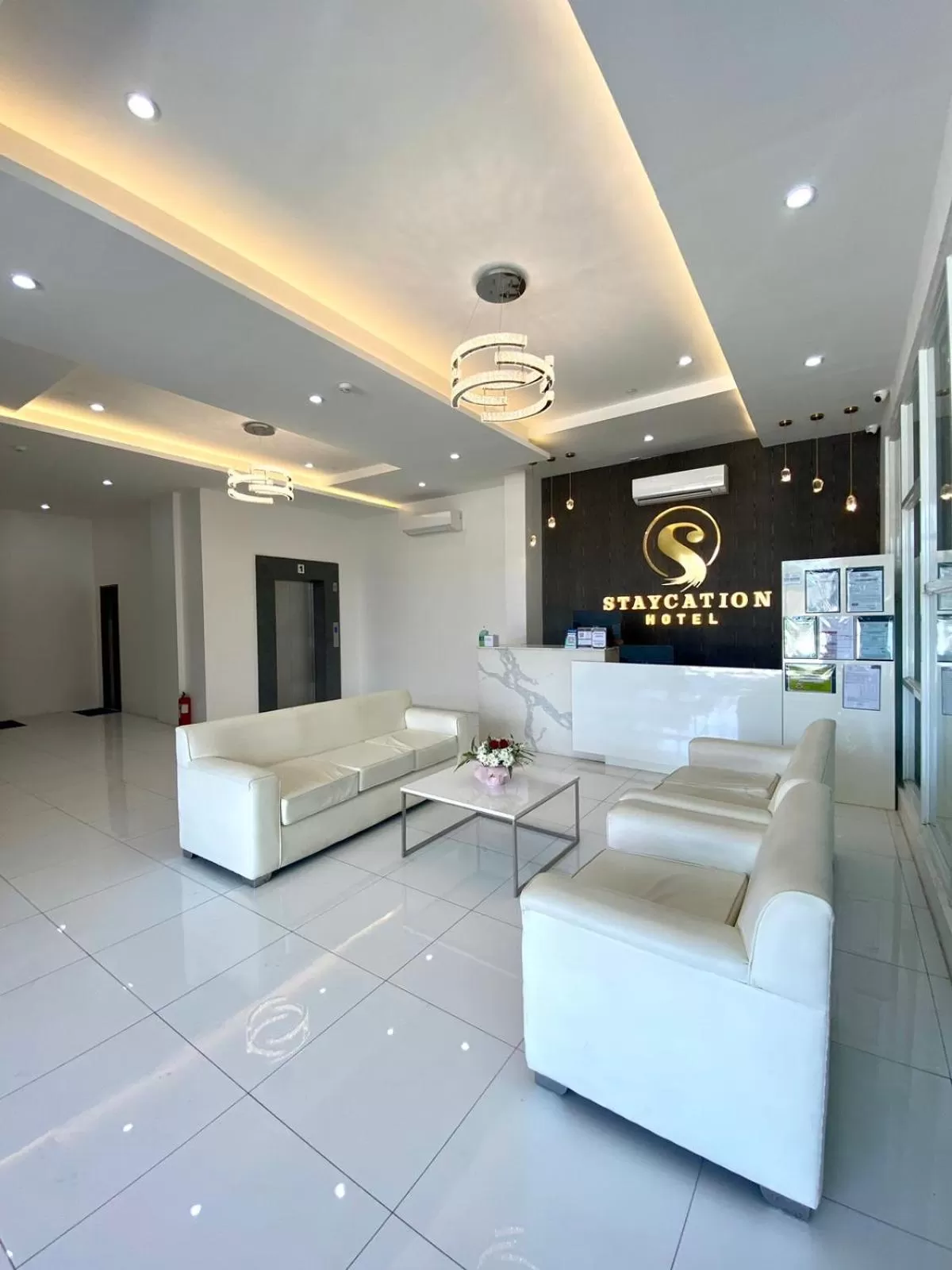 Lobby or reception in Staycation Hotel