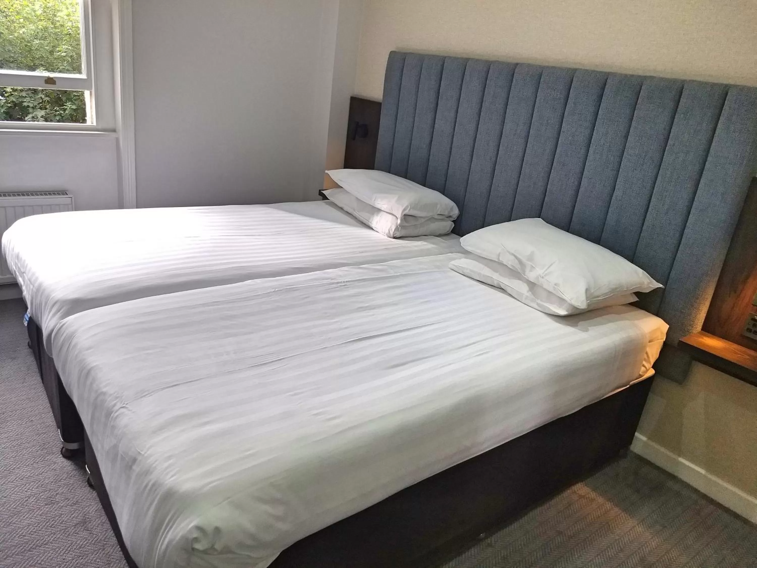 Bed in Garden Court Hotel