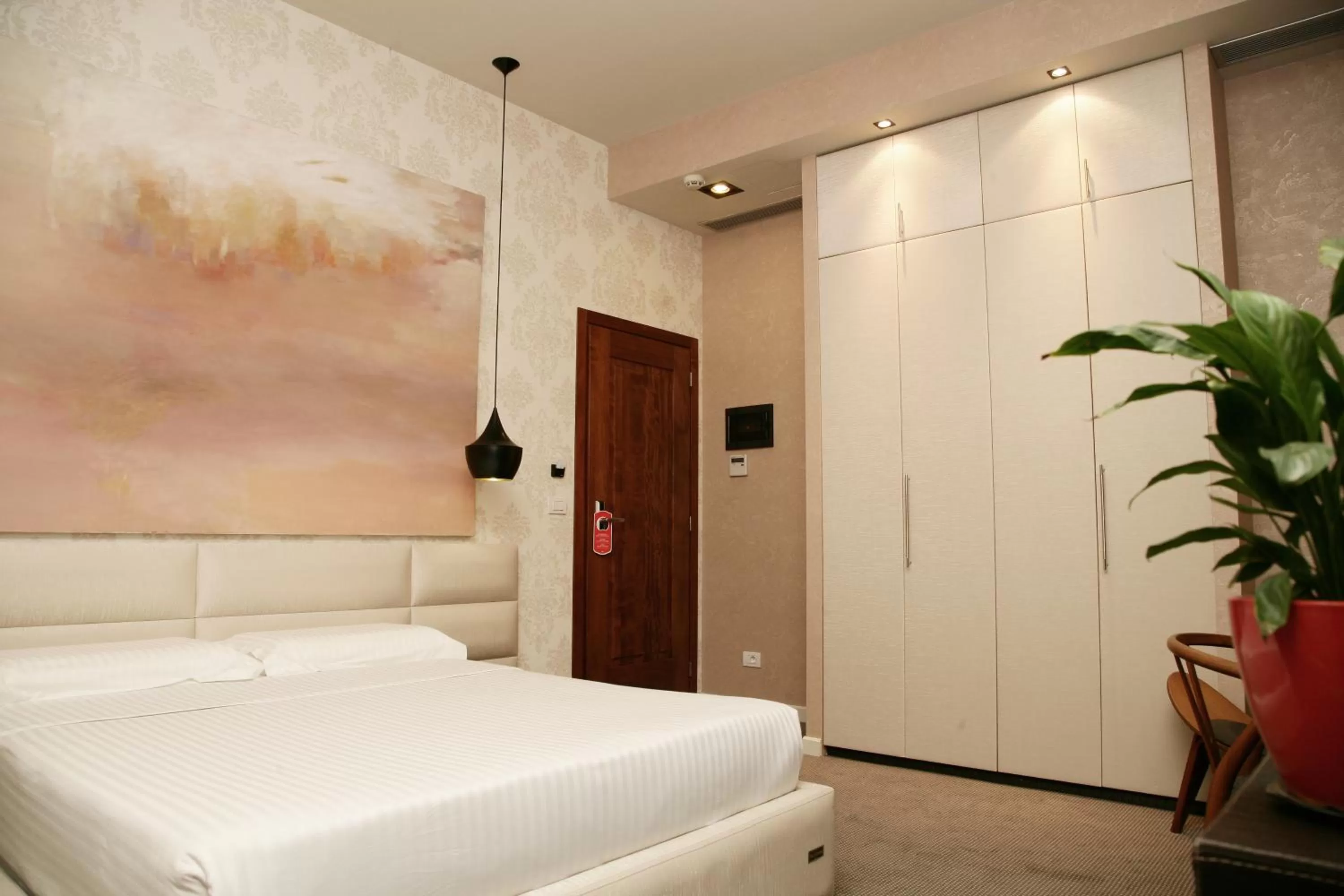 Bed in La Bohème Hotel