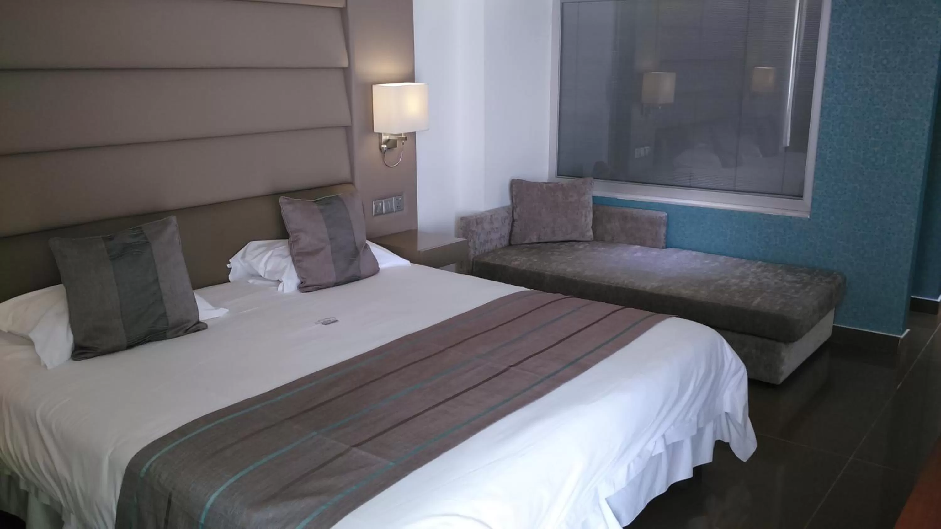 Bed in King Evelthon Beach Hotel & Resort