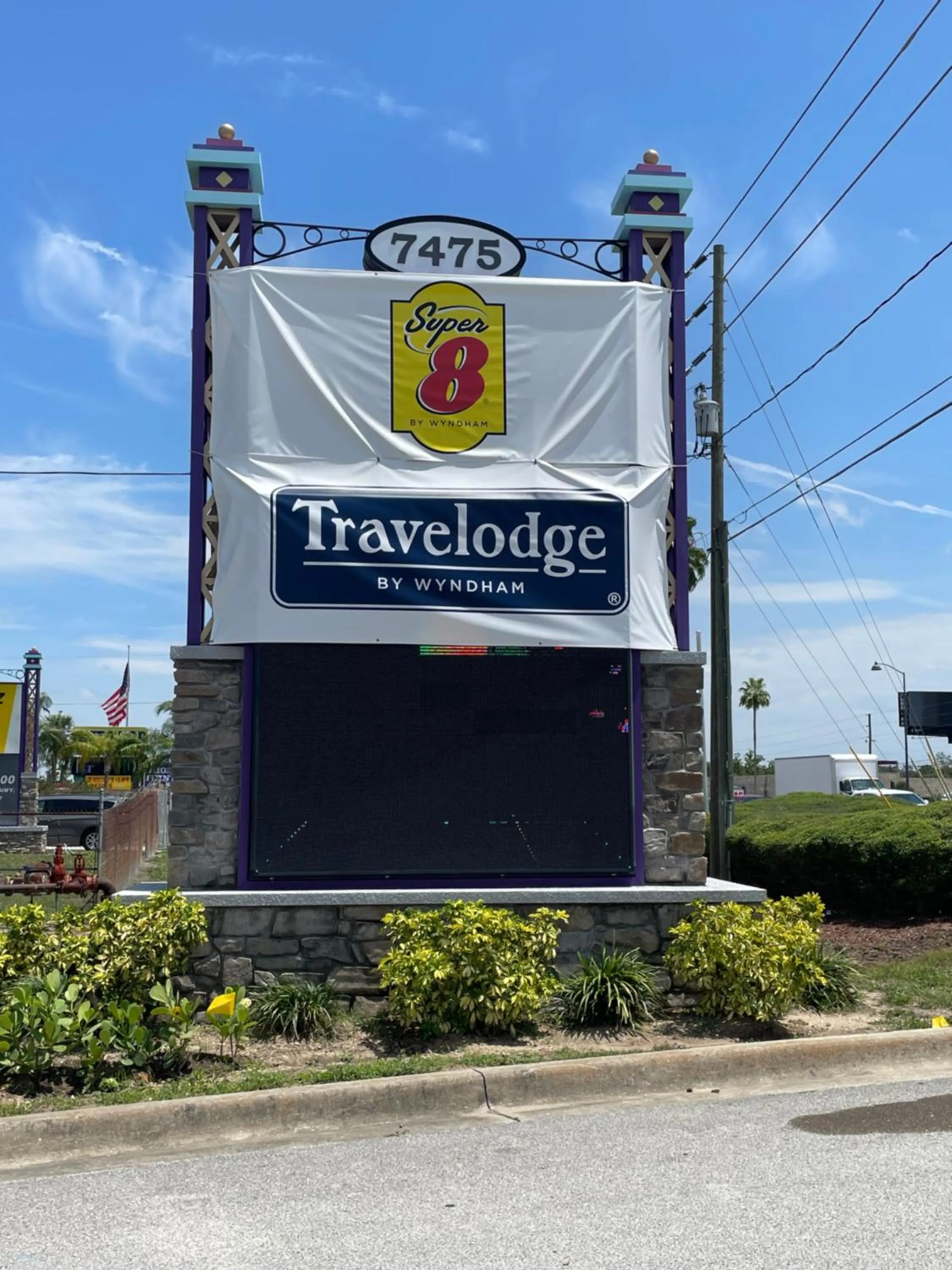 Property logo or sign in Super 8 by Wyndham Kissimmee-Orlando