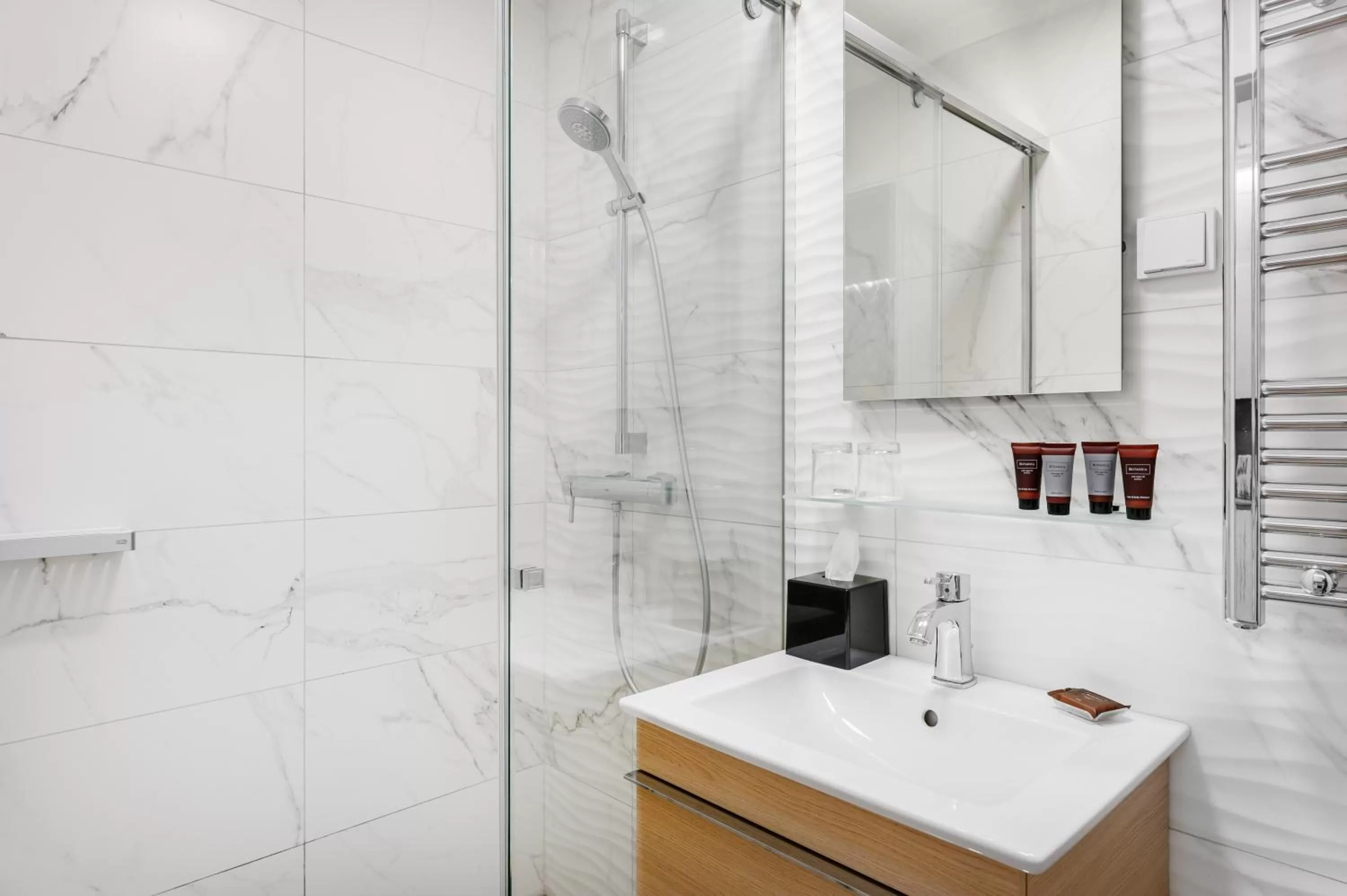 Bathroom in Emerald Downtown Luxury Suites by Continental Group