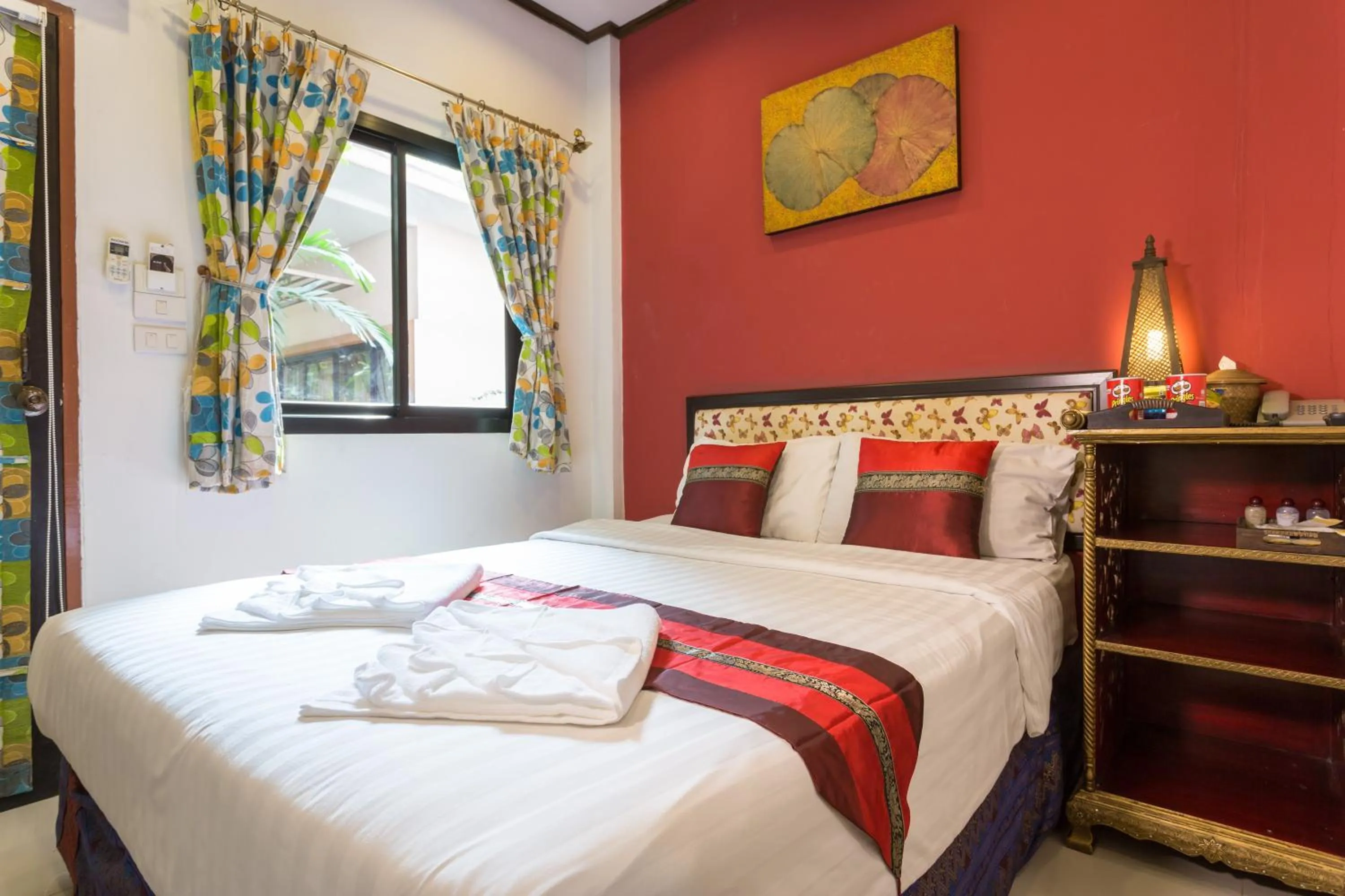 Bed in PloyKhumThong Boutique Resort