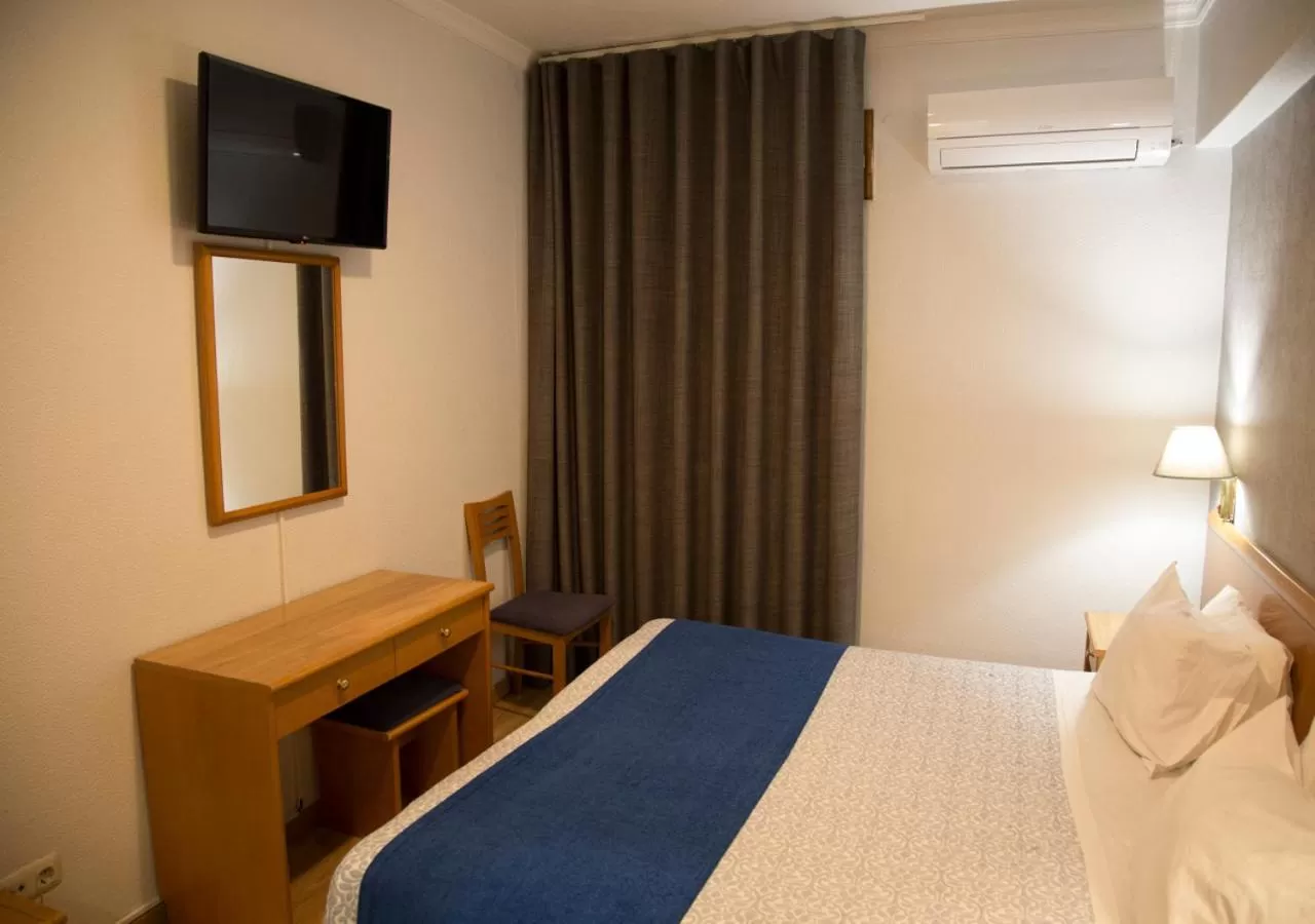 Bed in Hotel Columbano