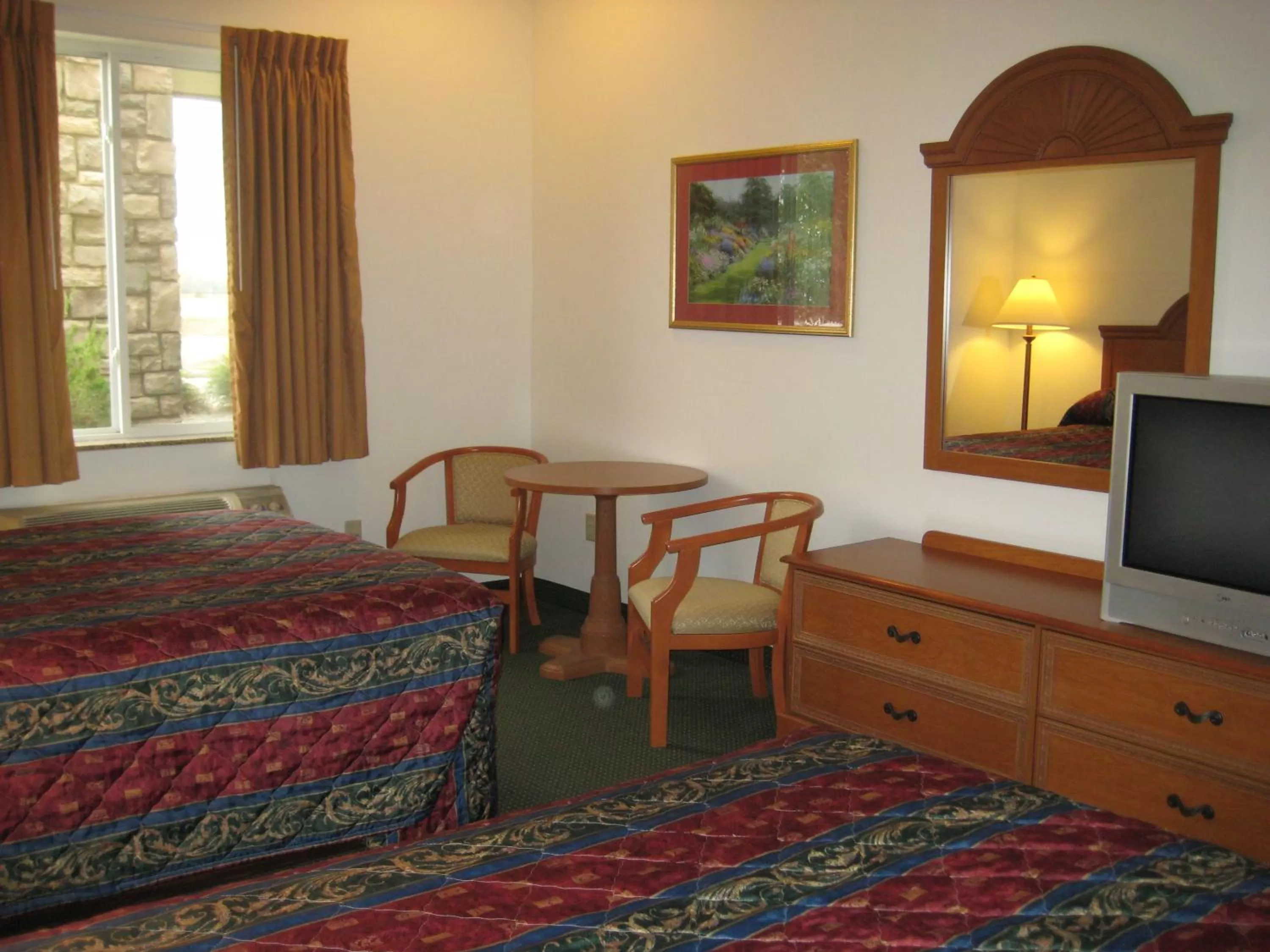 Bed in Horizon Inn & Suites