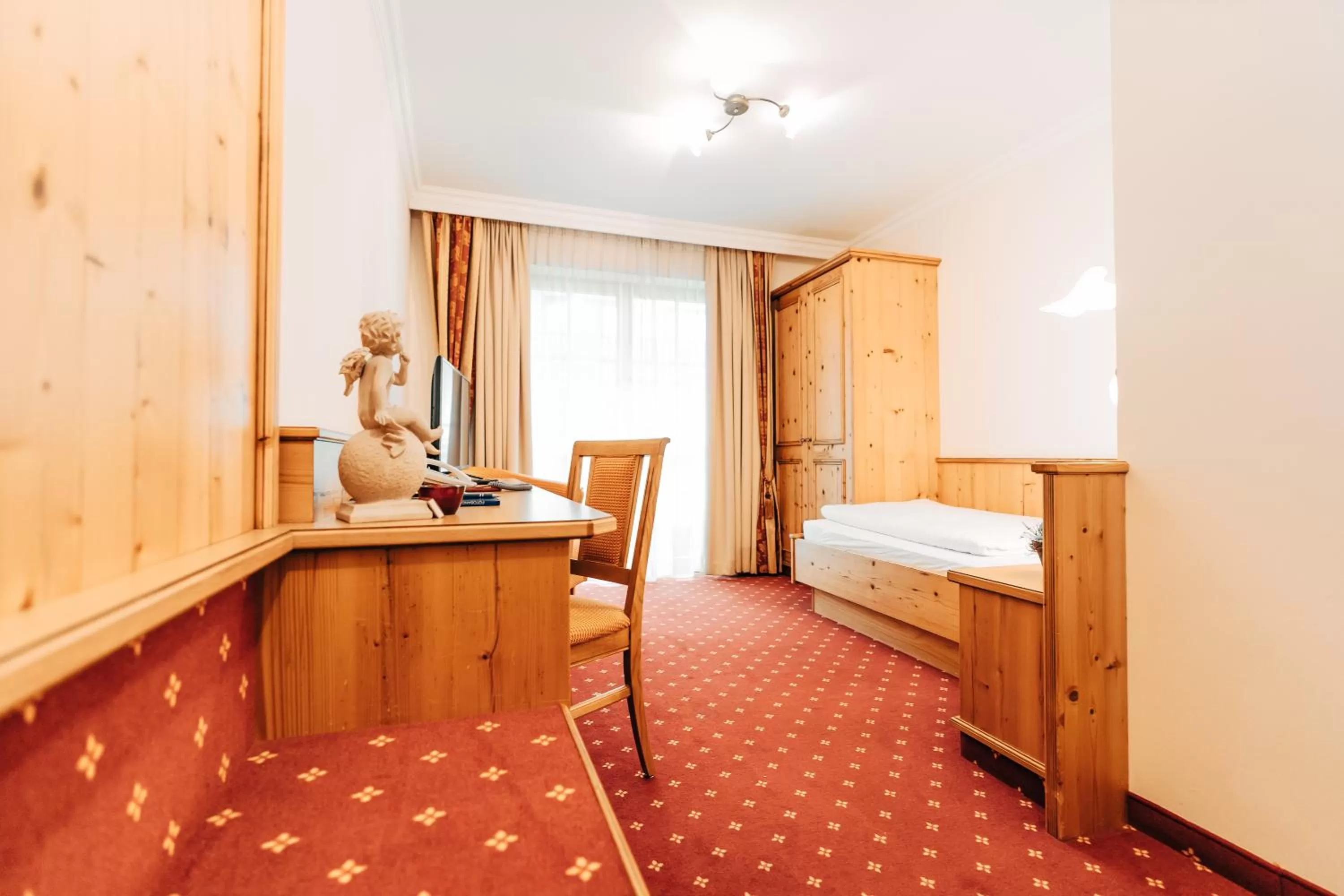 Bed in POST POST Hotel - Alpine Boutique Hotel & Spa