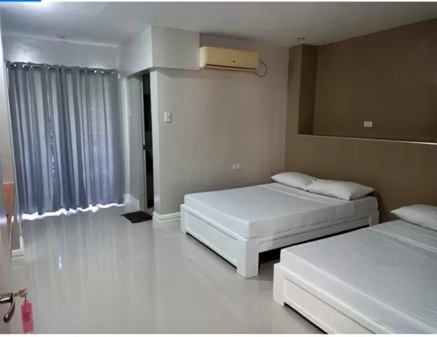 Bed in Sandscape Hotel