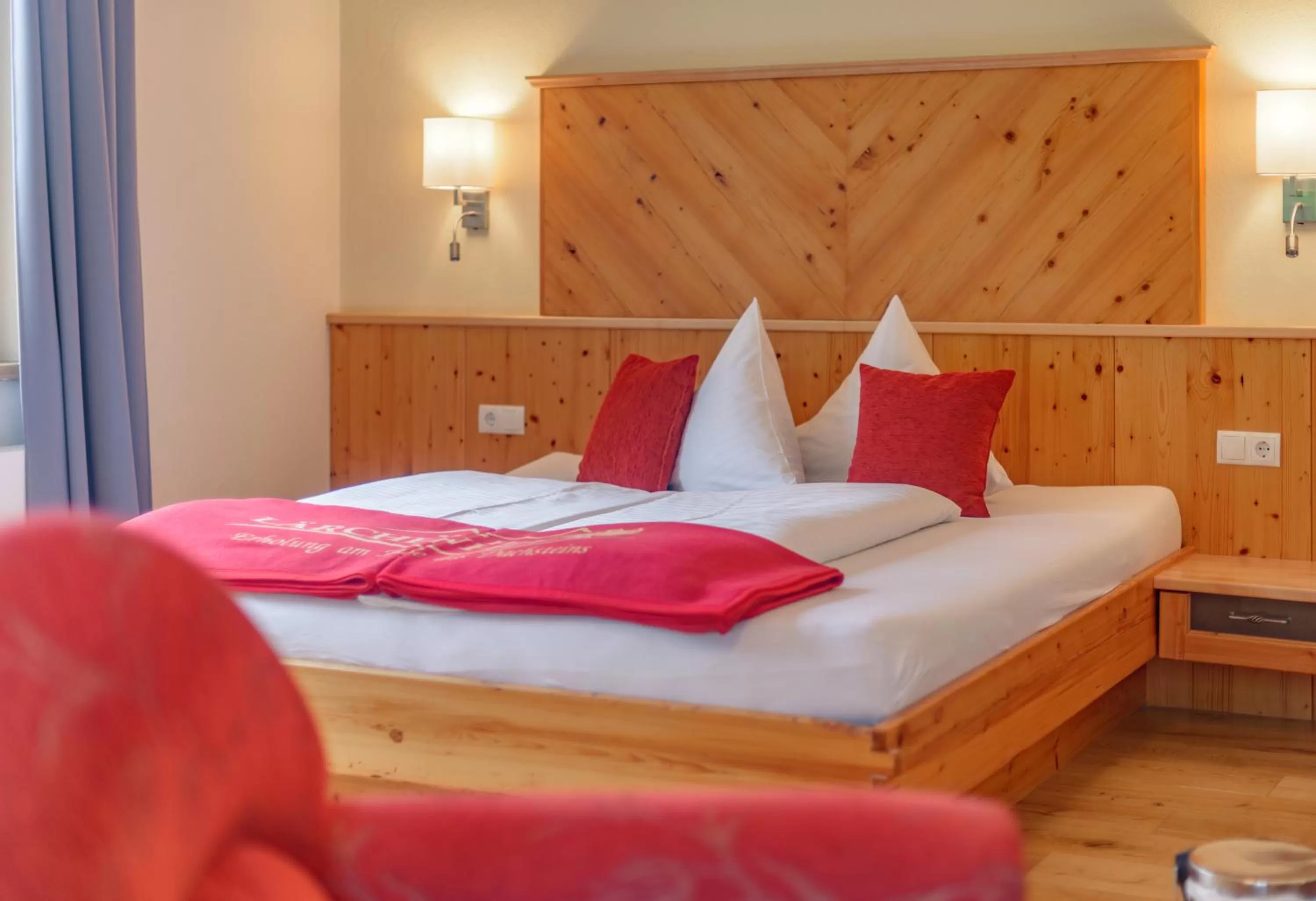 Photo of the whole room, Bed in Naturhotel Lärchenhof