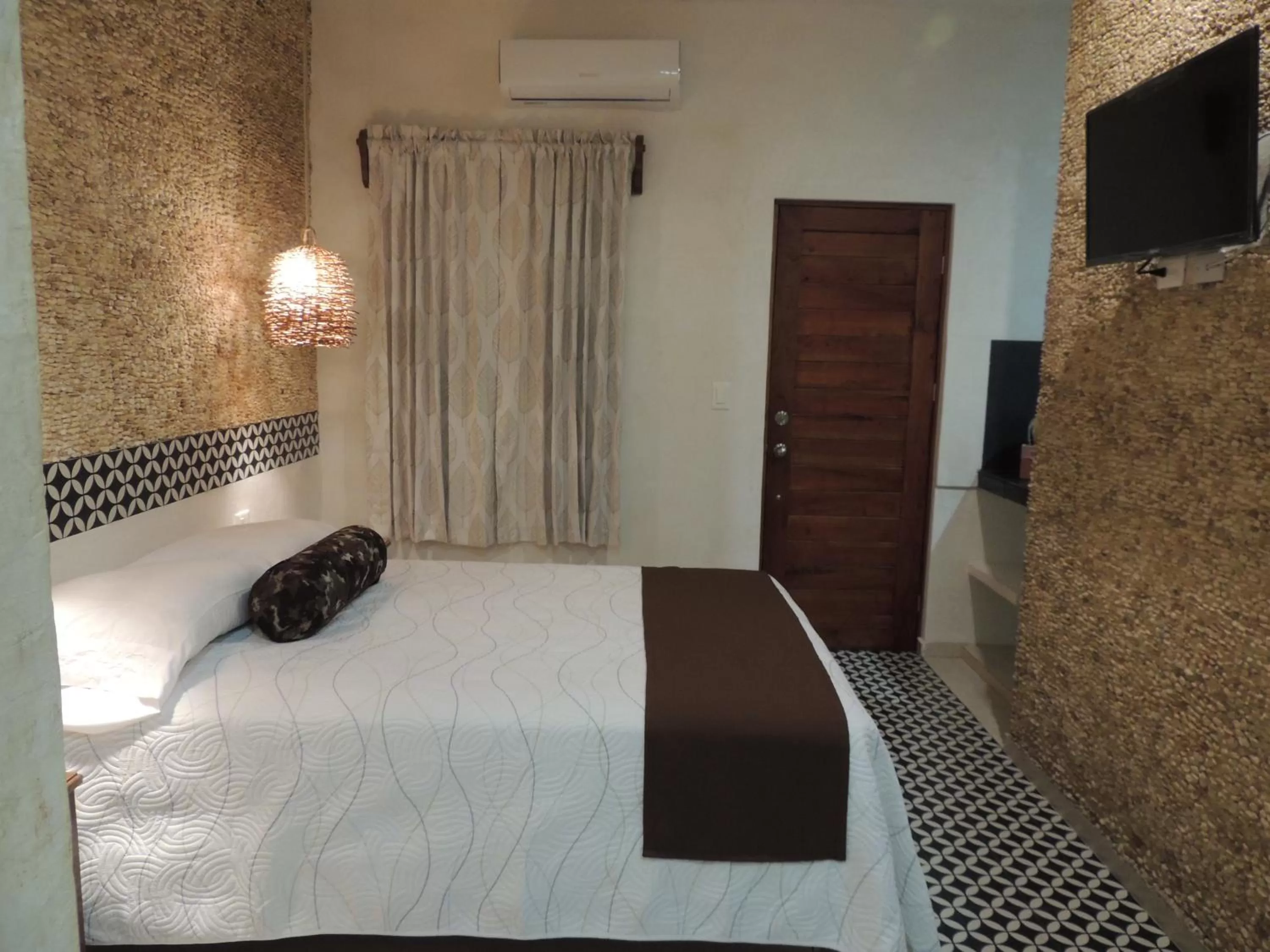 Bed in Hotel Boutique Bugambilias