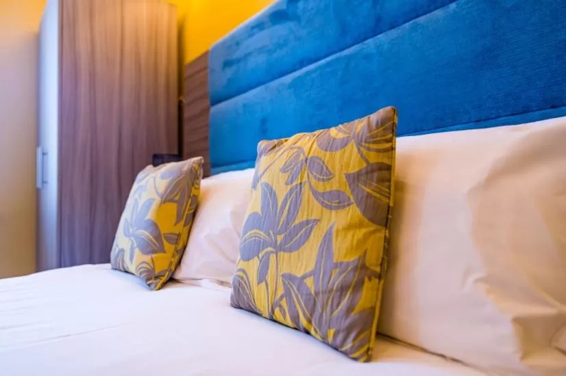 Bed in Stonecross Manor Hotel