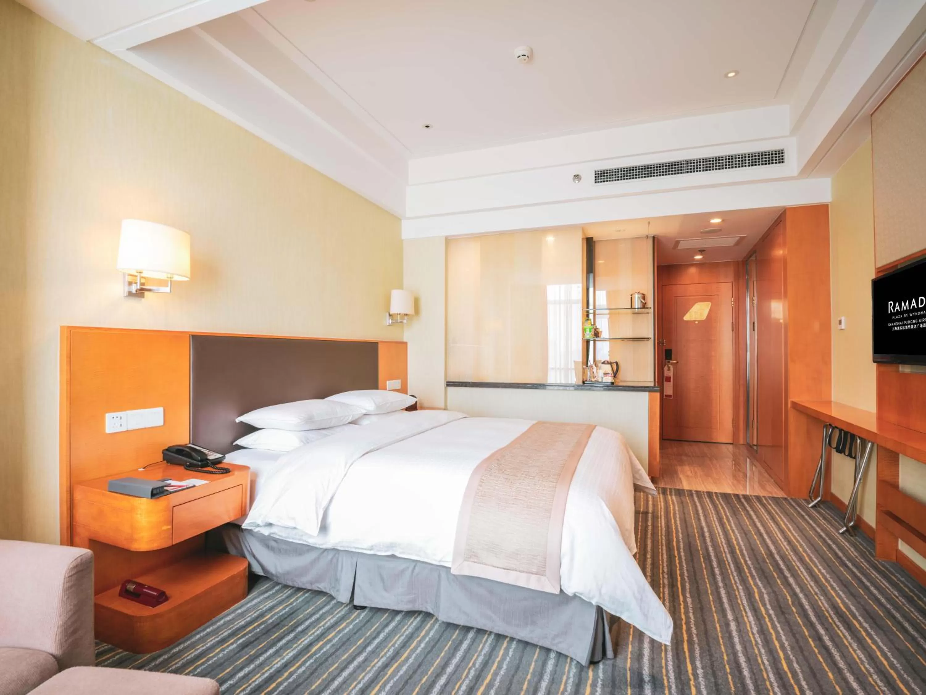 Bed in Ramada Plaza Shanghai Pudong Airport - 3 mins to PVG depature floor & check entrance with hotel shuttle