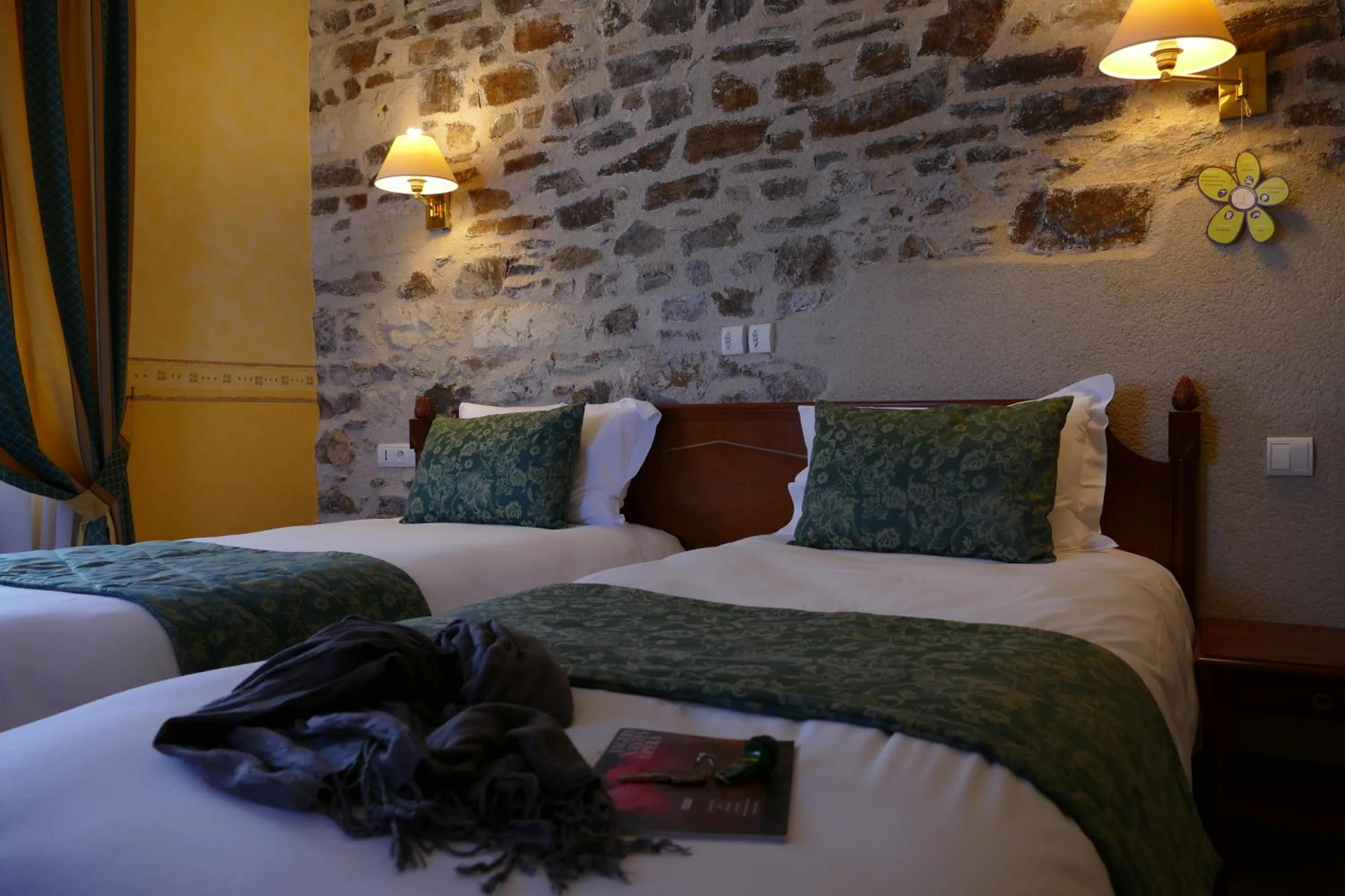 Photo of the whole room, Bed in Logis Hotels Le Champalud Restaurant La Citadelle