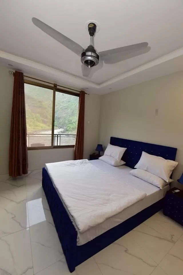 Bed in Hotel La Orilla Muzaffarabad