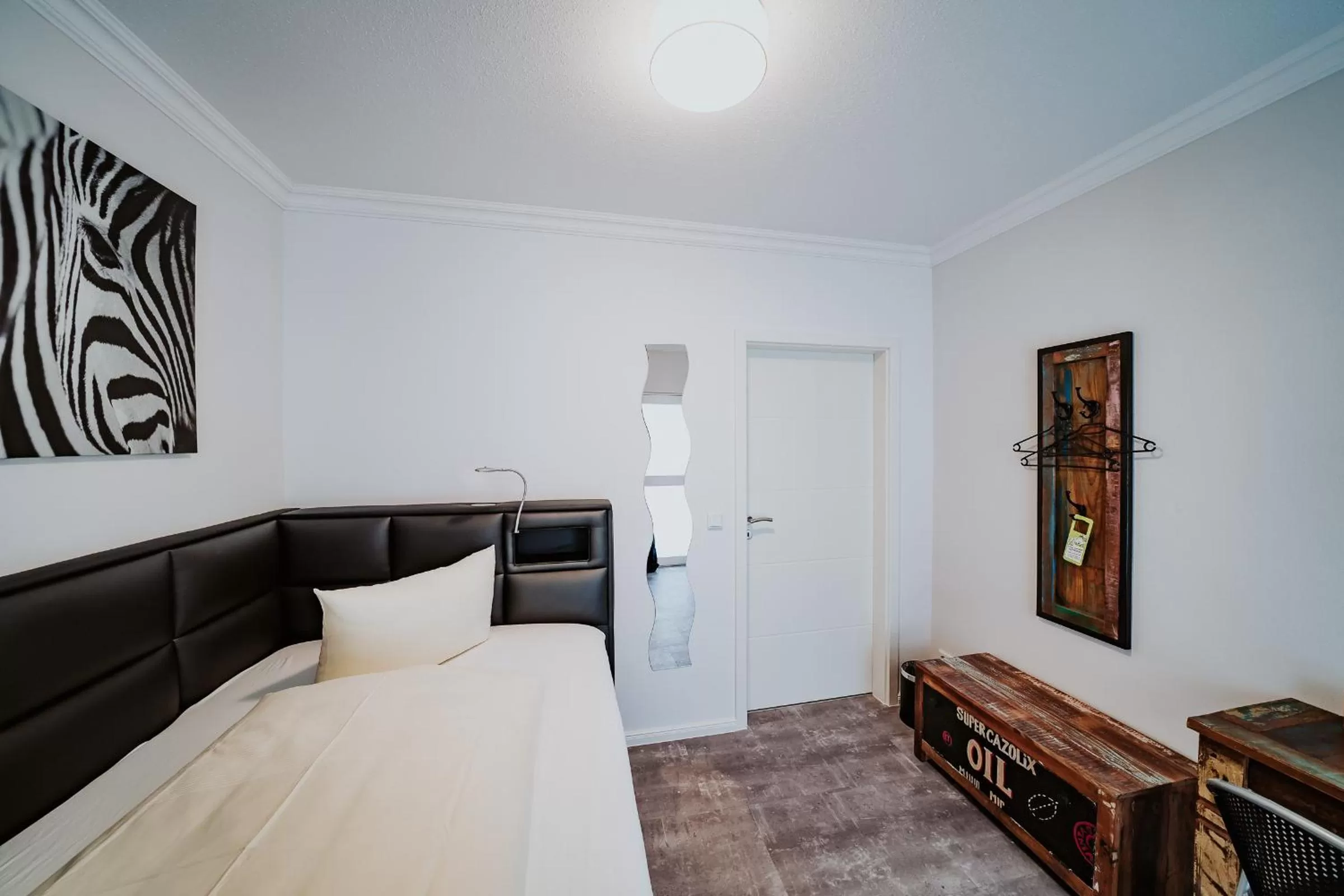 Living room, Bed in RobrookS Hotel Garni