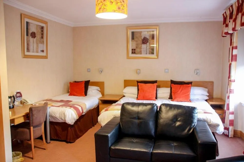 Bed in Station Hotel And Restaurant