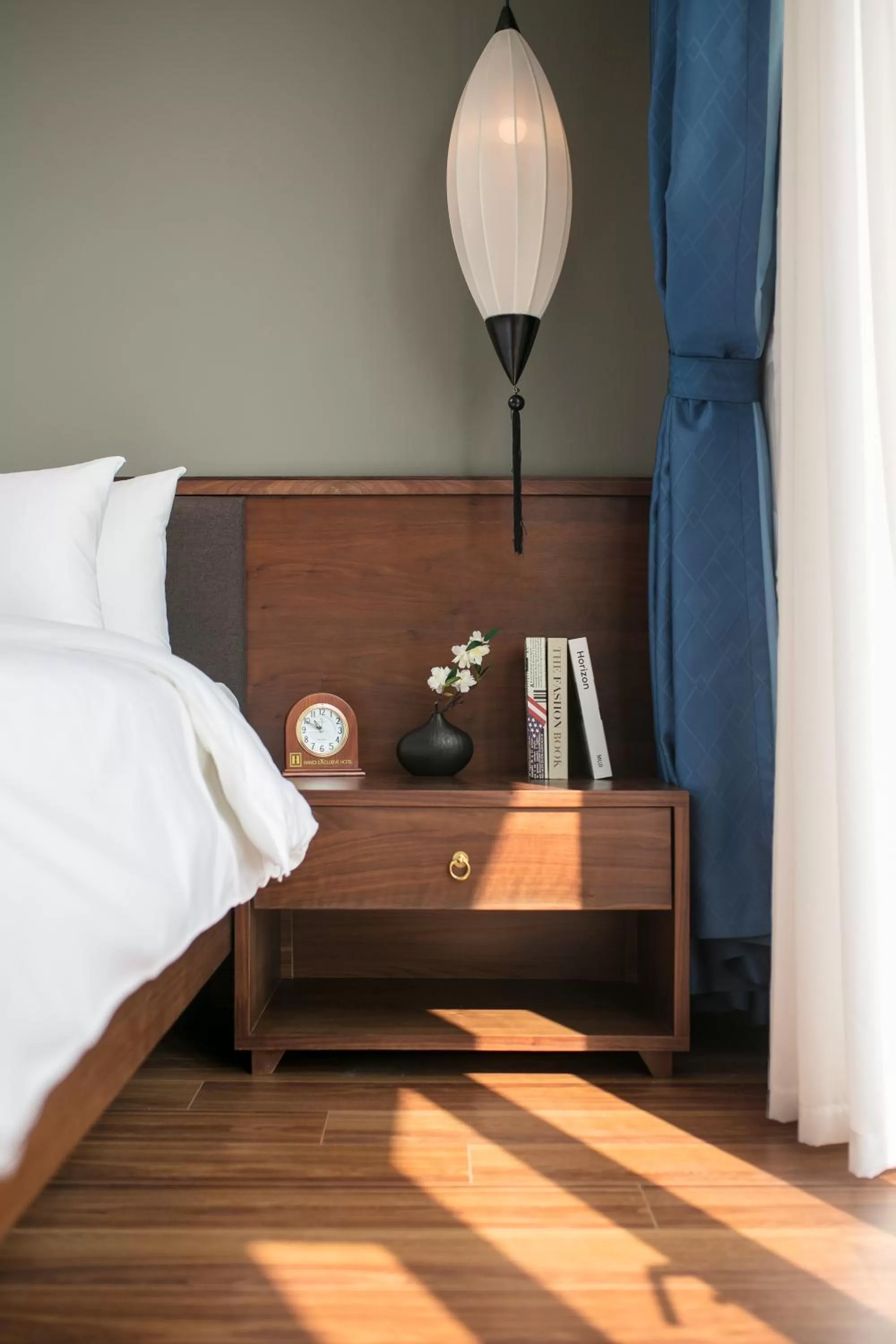 Living room, Bed in Hanoi Exclusive Hotel