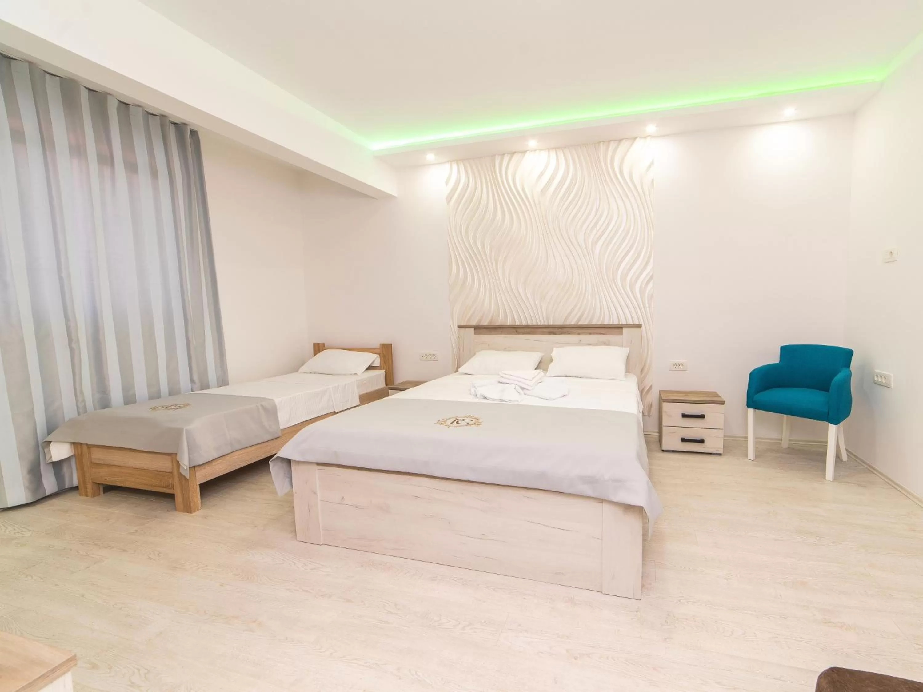 Bed in Hotel Royal Garden