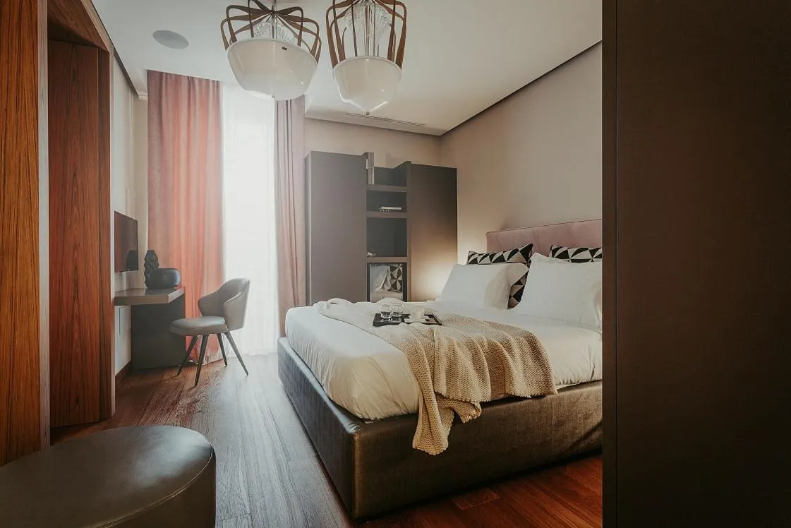 Bed in Bacã Suites, Restaurant & Bar