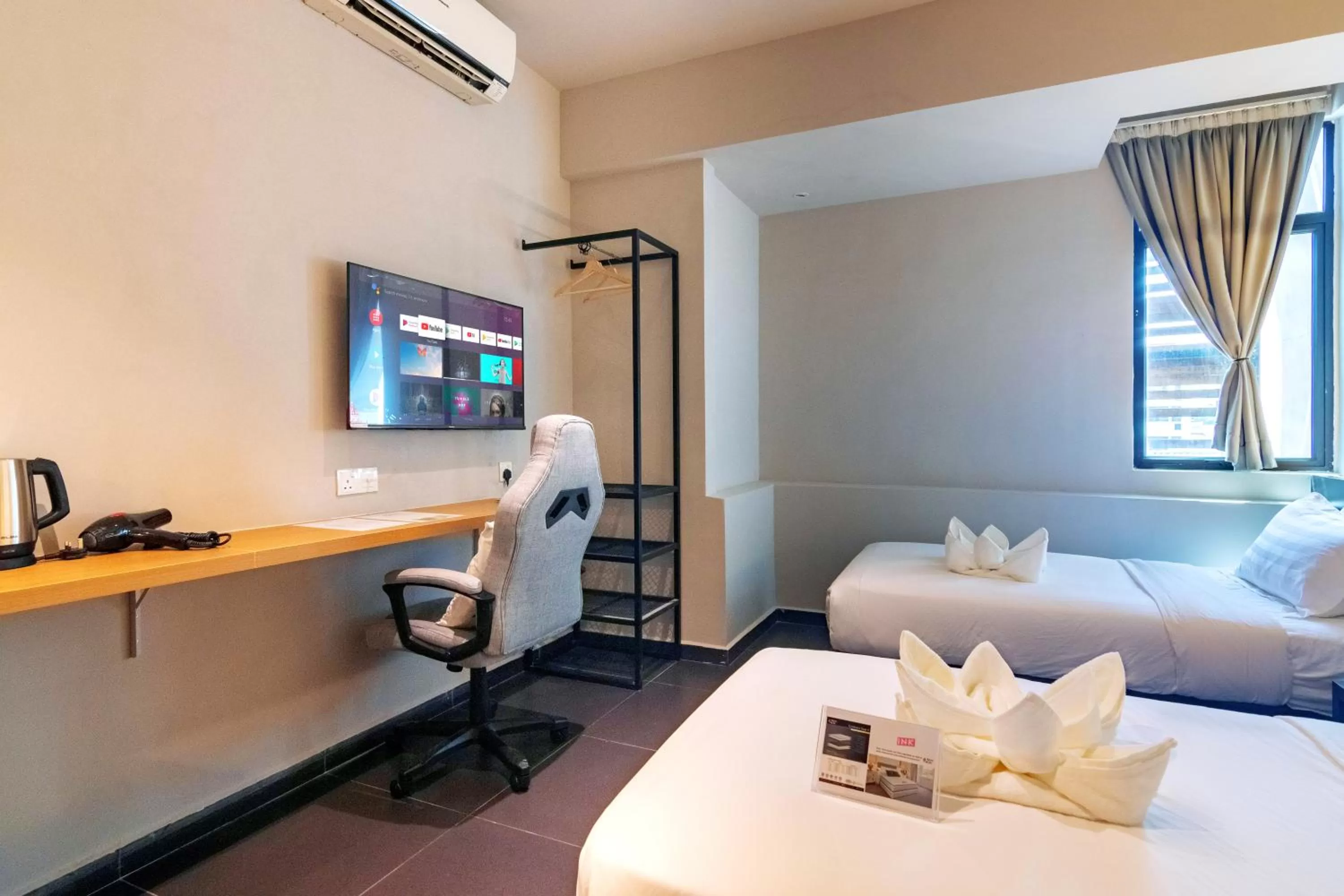 Bed, TV/Entertainment Center in Ink Hotel by ALV