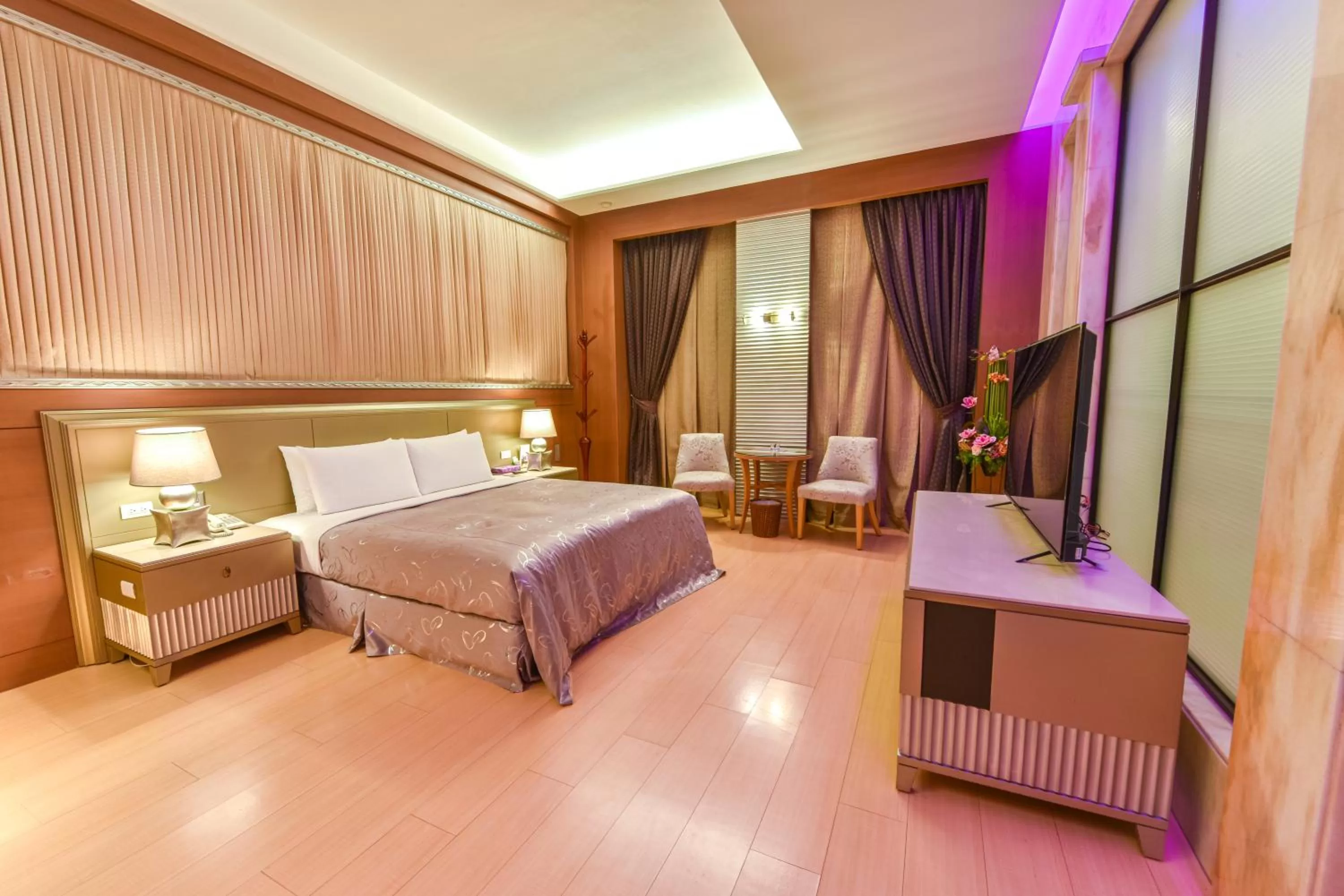 Bed in Purple Garden Motel