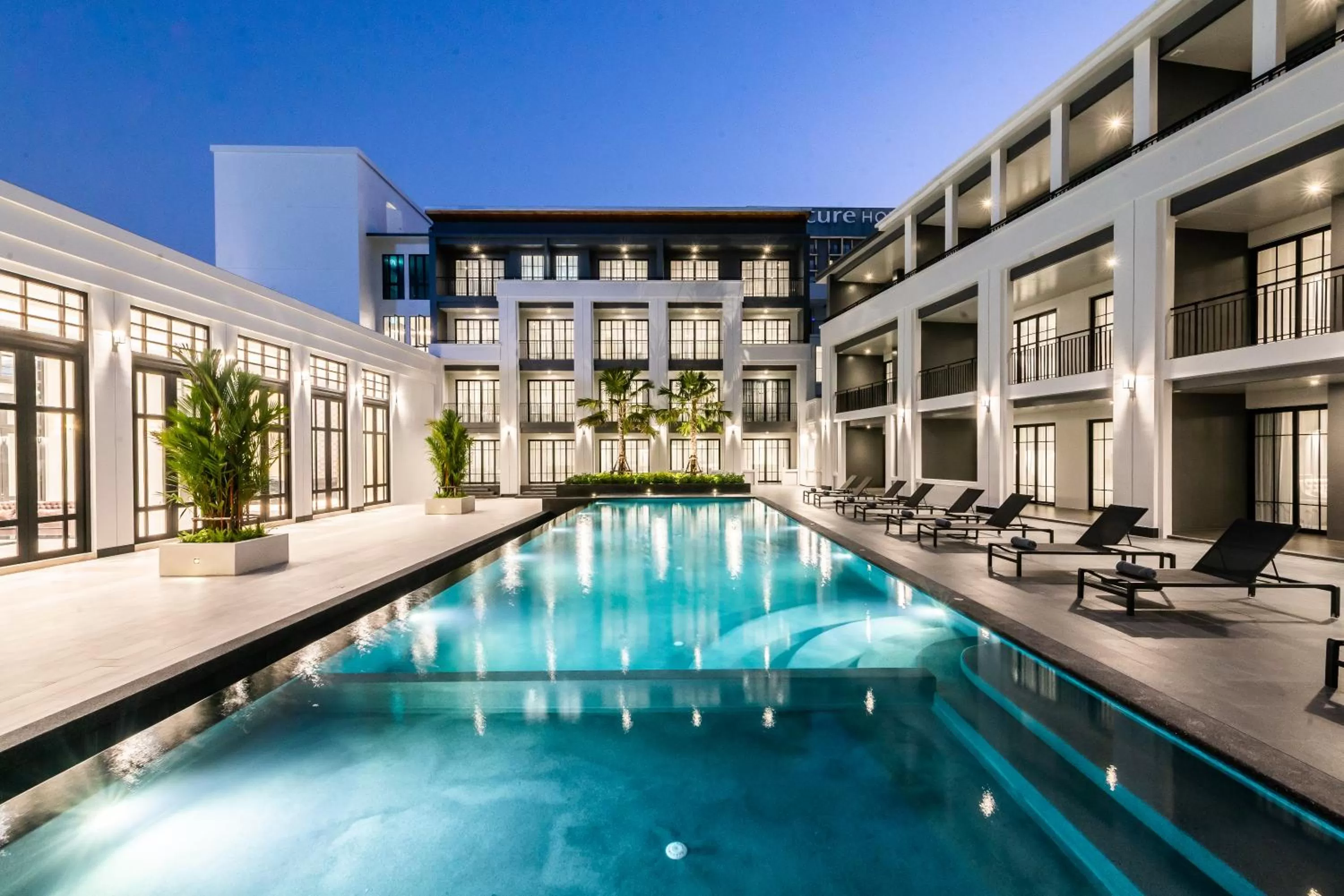 Swimming pool in One Patio Hotel Pattaya - SHA Extra Plus