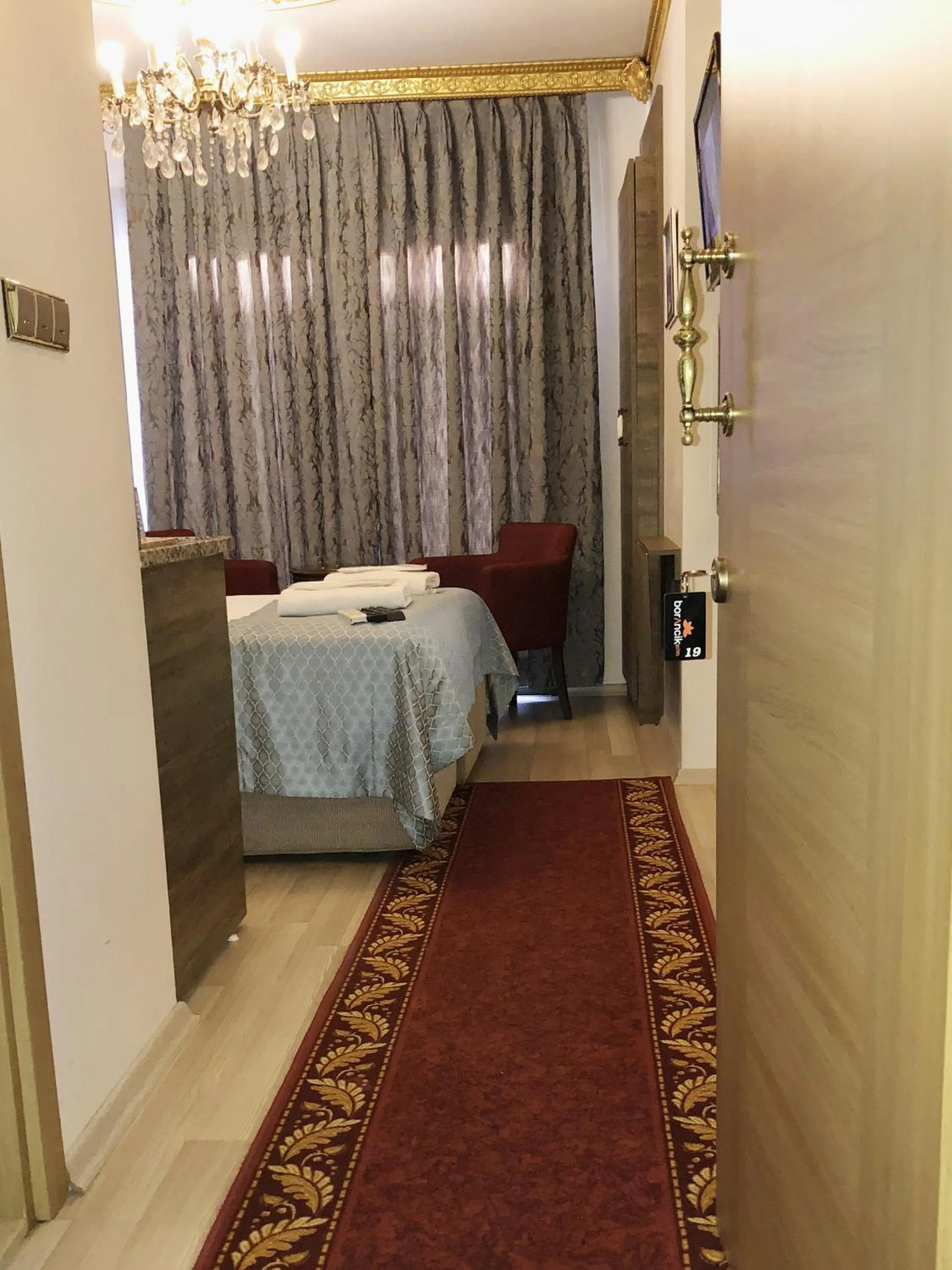 Seating area, Bed in Borancik Suites