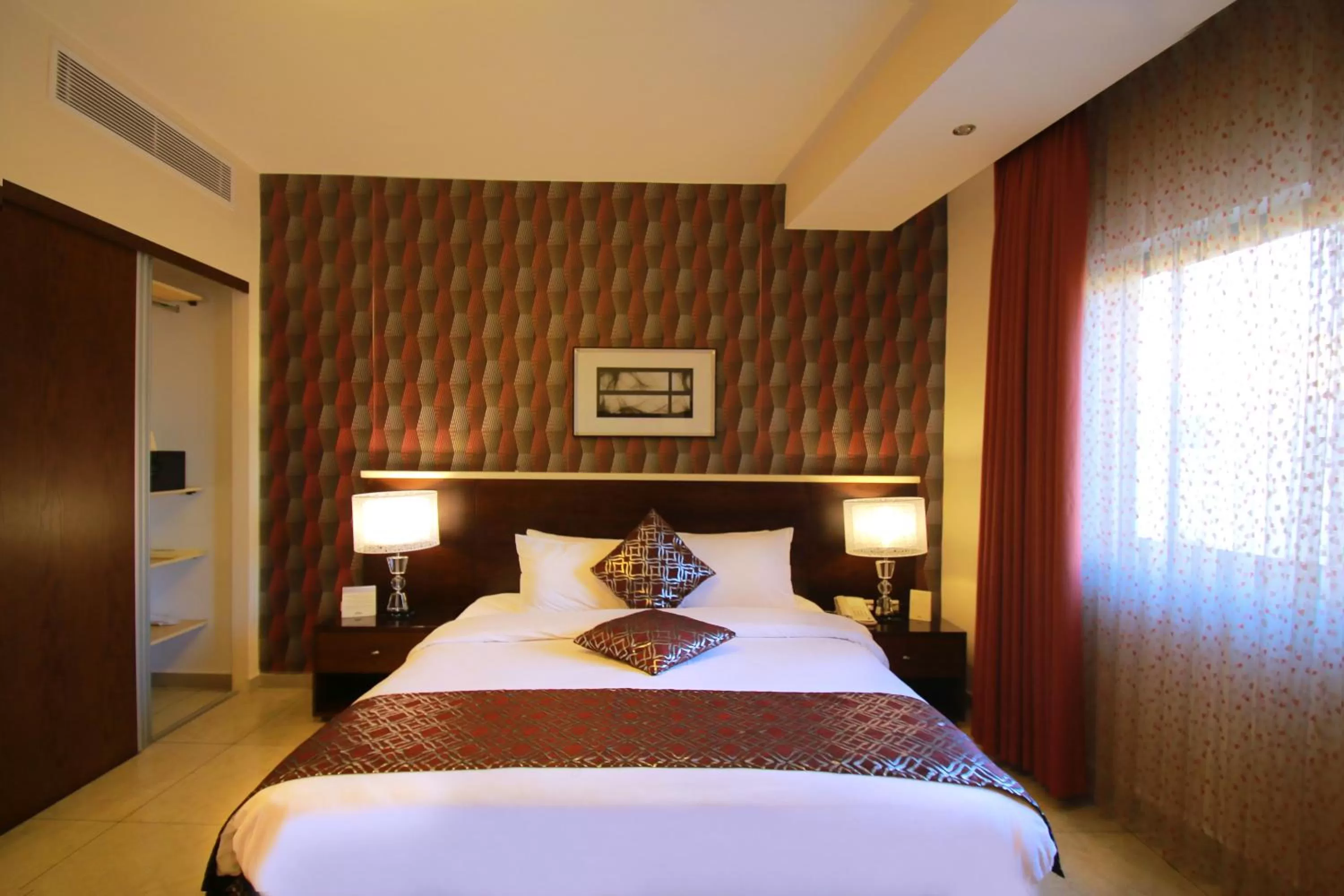 Bed in City Rose Hotel Suites