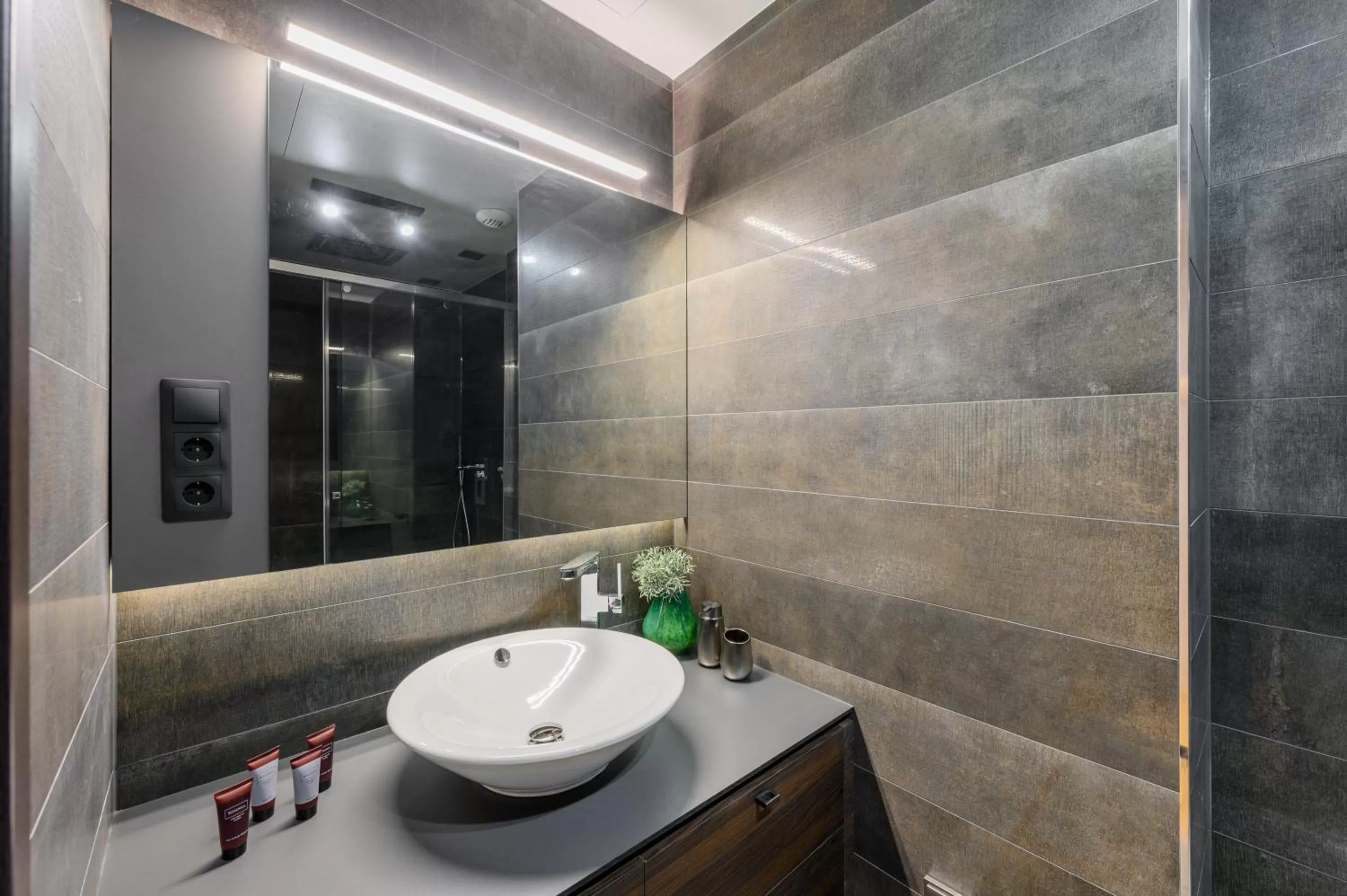 Bathroom in Emerald Downtown Luxury Suites by Continental Group