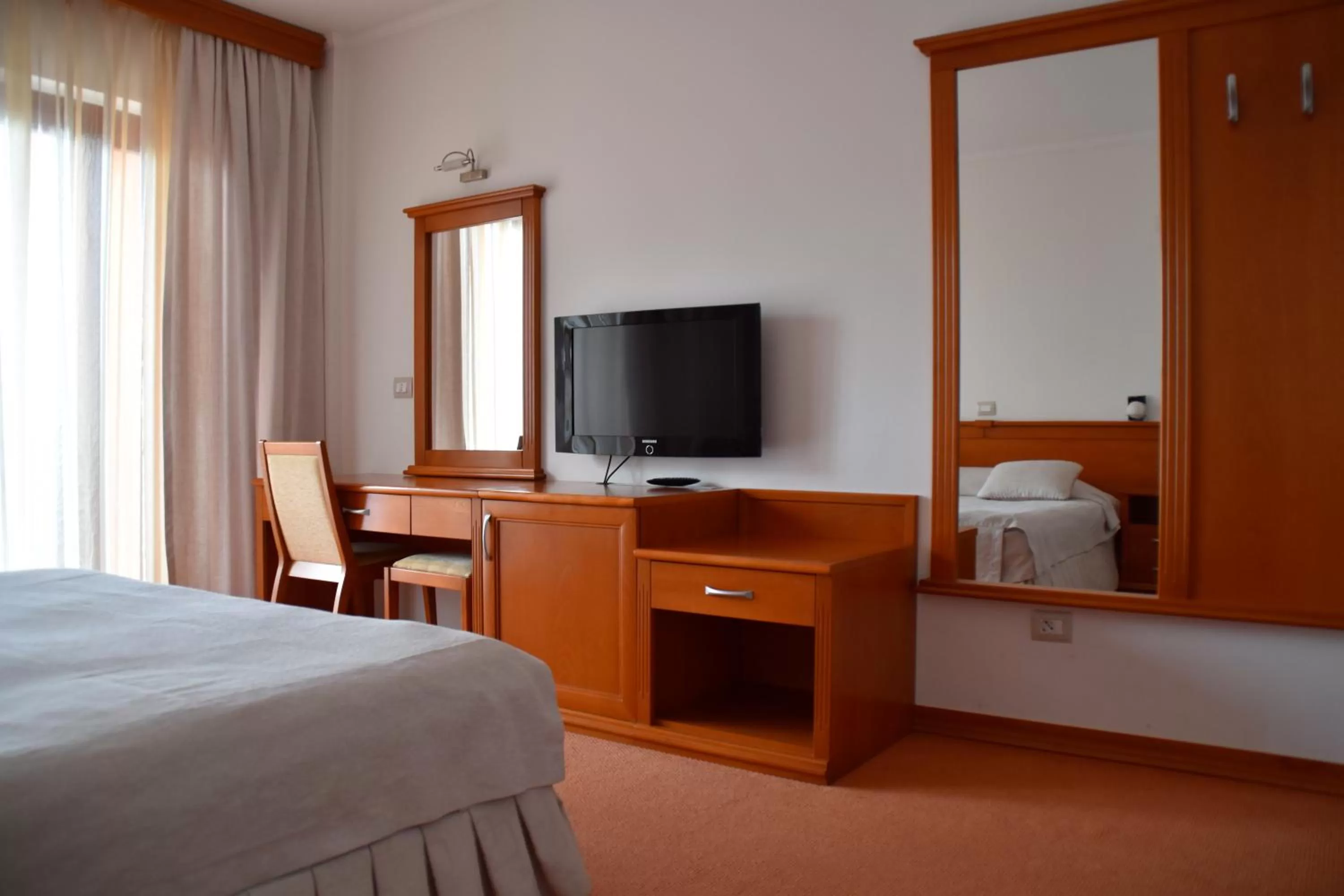 Photo of the whole room, TV/Entertainment Center in Hotel Millennium