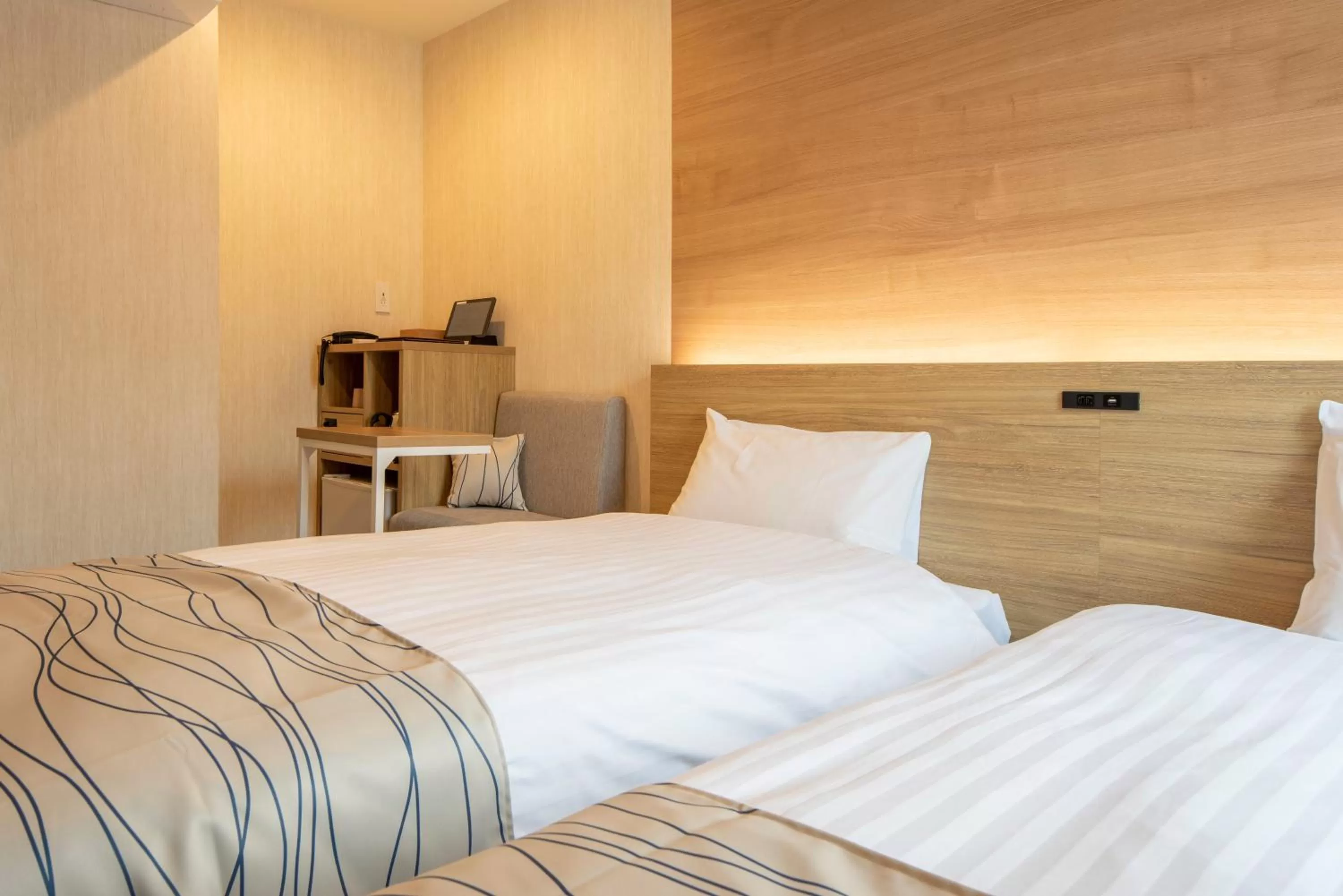 Bed in HOTEL AMANEK Asahikawa