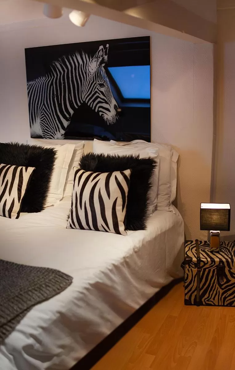 Bed in Bienvenue Chez Nous