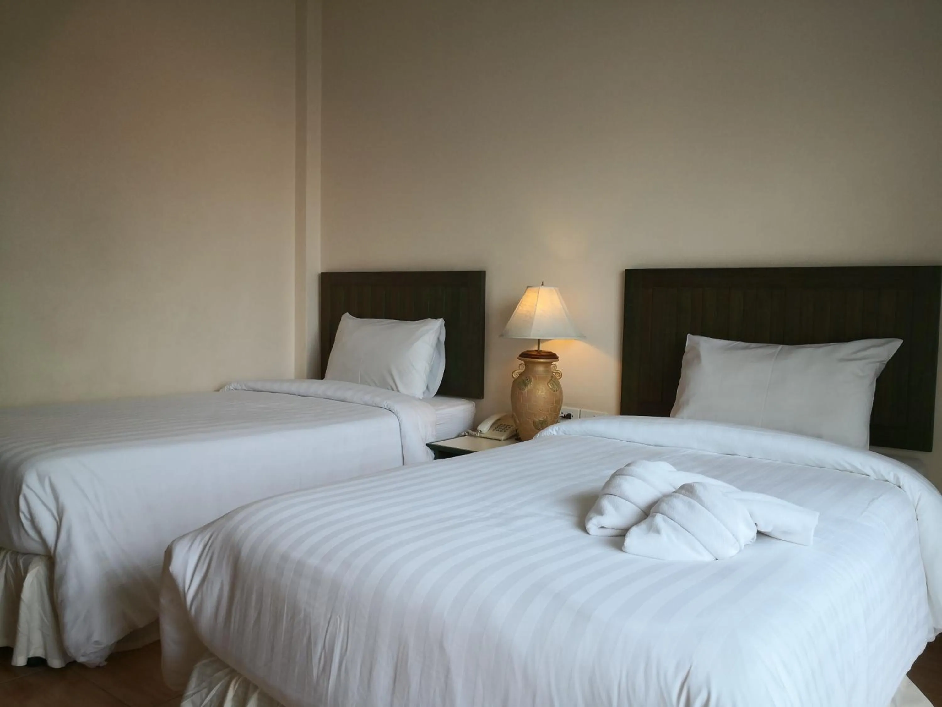 Bed in Baan Suksiri Hotel