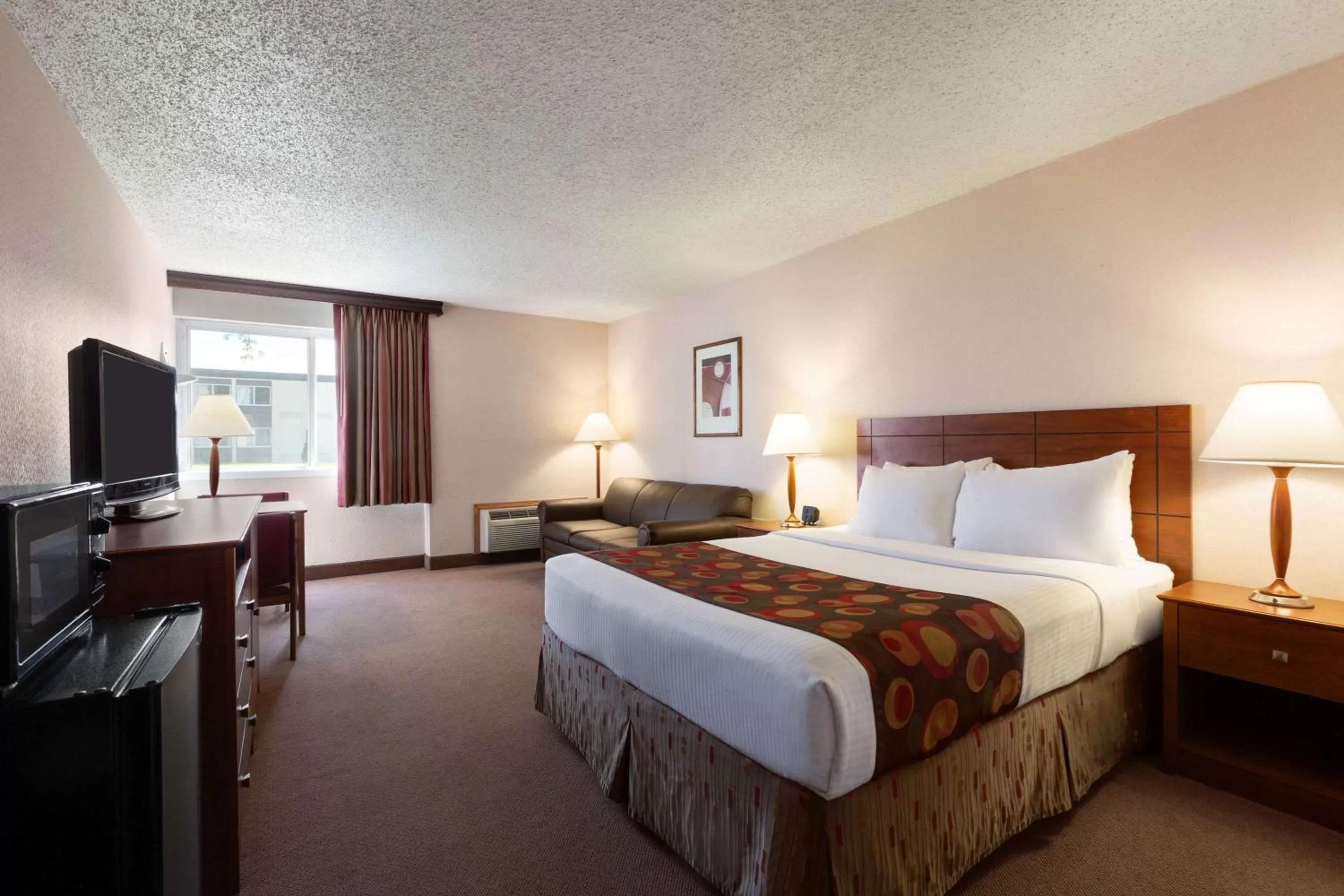 Photo of the whole room, Bed in Ramada by Wyndham Bismarck