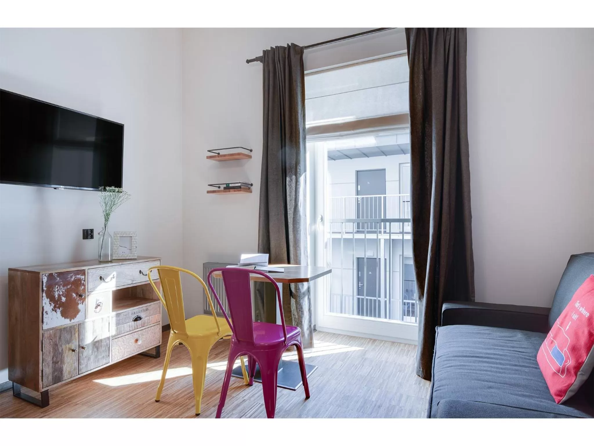 Communal lounge/ TV room in Well Well Aparthotel