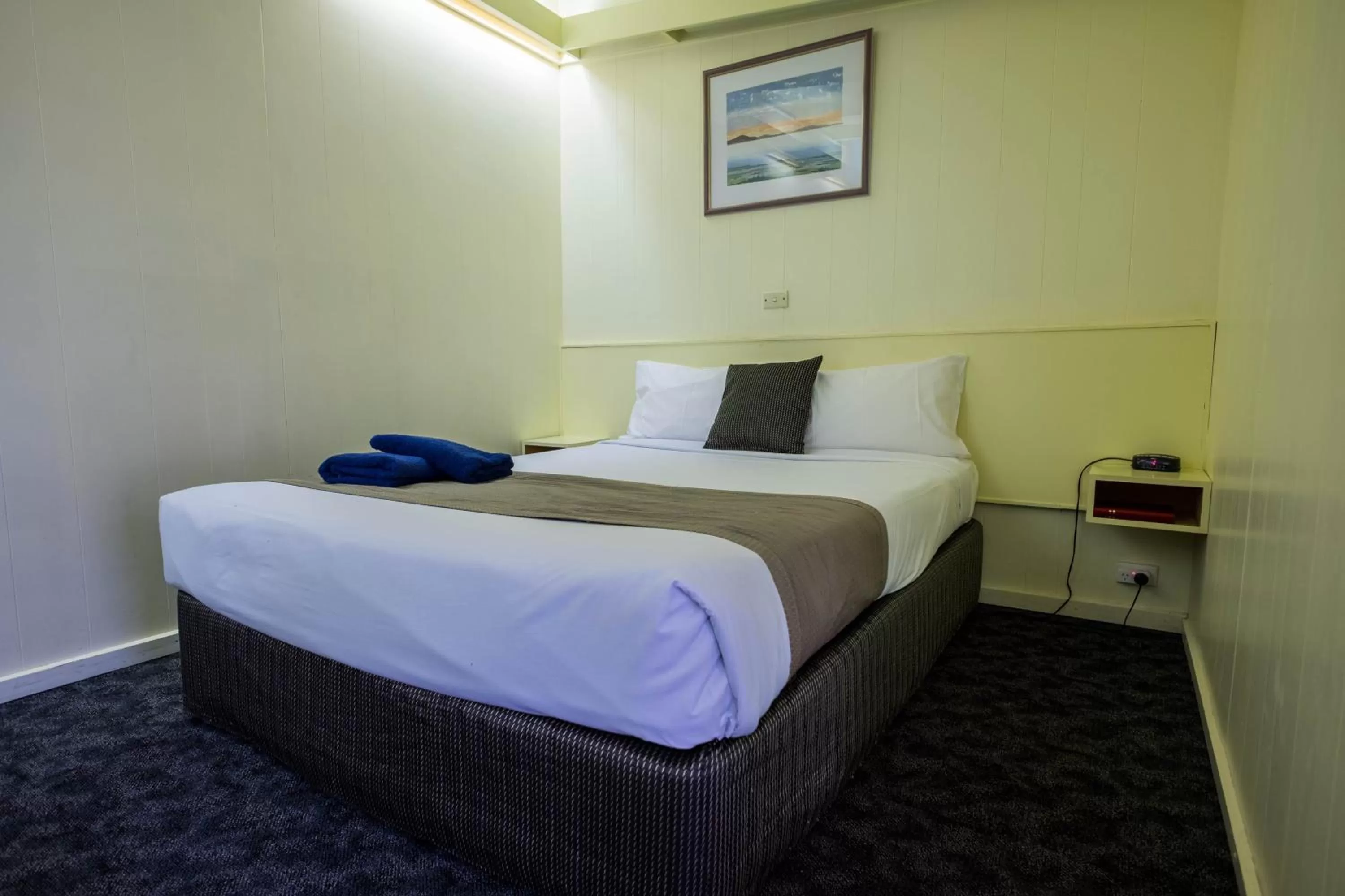 Bed in Pioneer Station Motor Inn