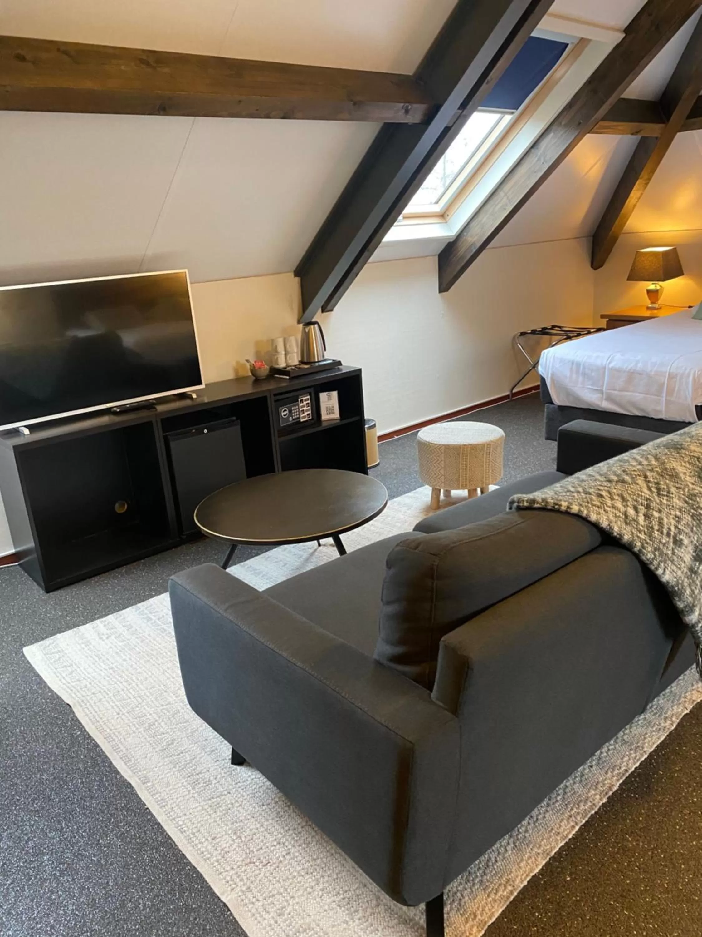 Seating area, Bed in Hotel Hof van 's Gravenmoer