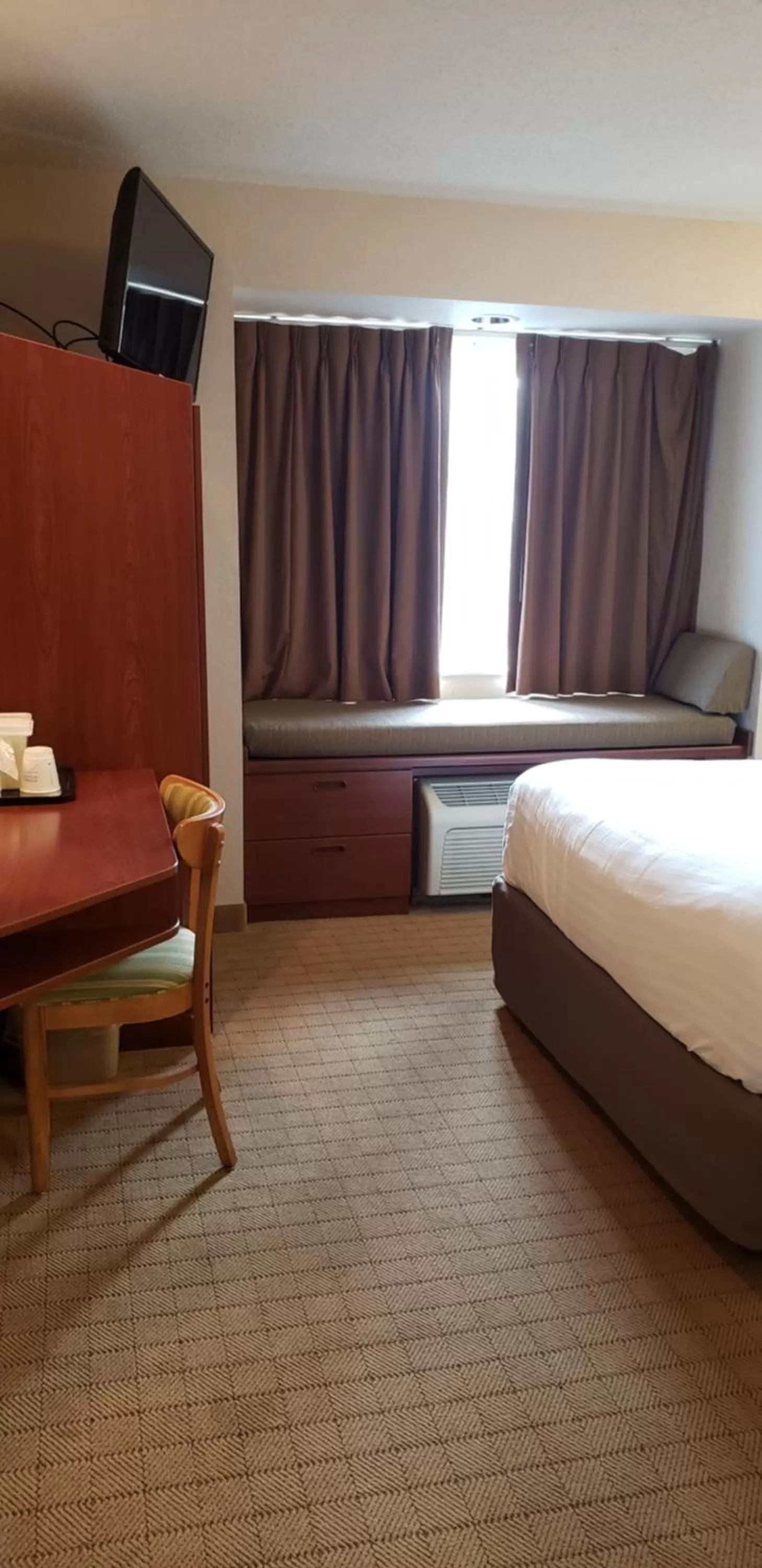 Bed in Microtel Inn & Suites by Wyndham Wellsville