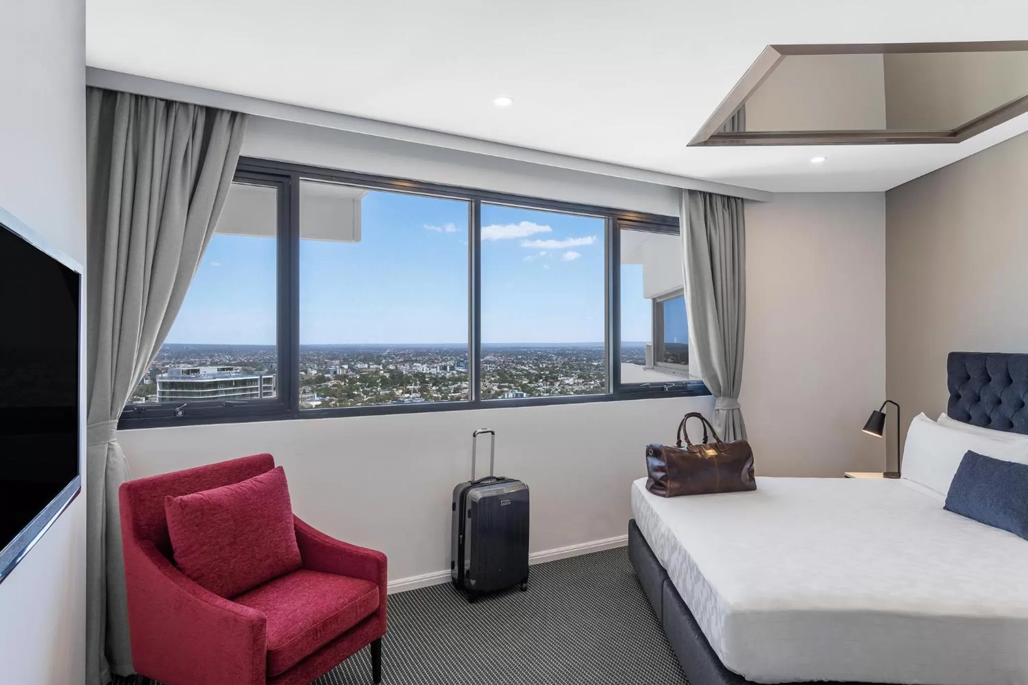 Bed in Meriton Suites Kent Street, Sydney