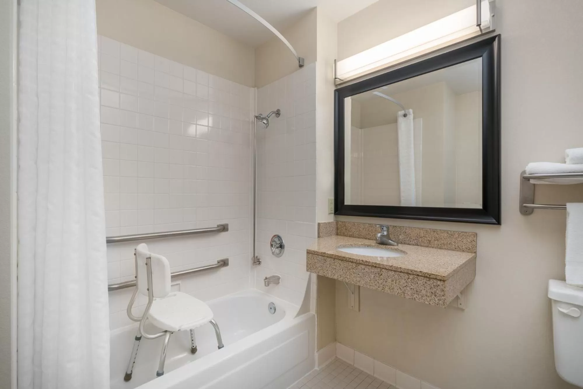 Shower in AmericInn by Wyndham Johnston Des Moines