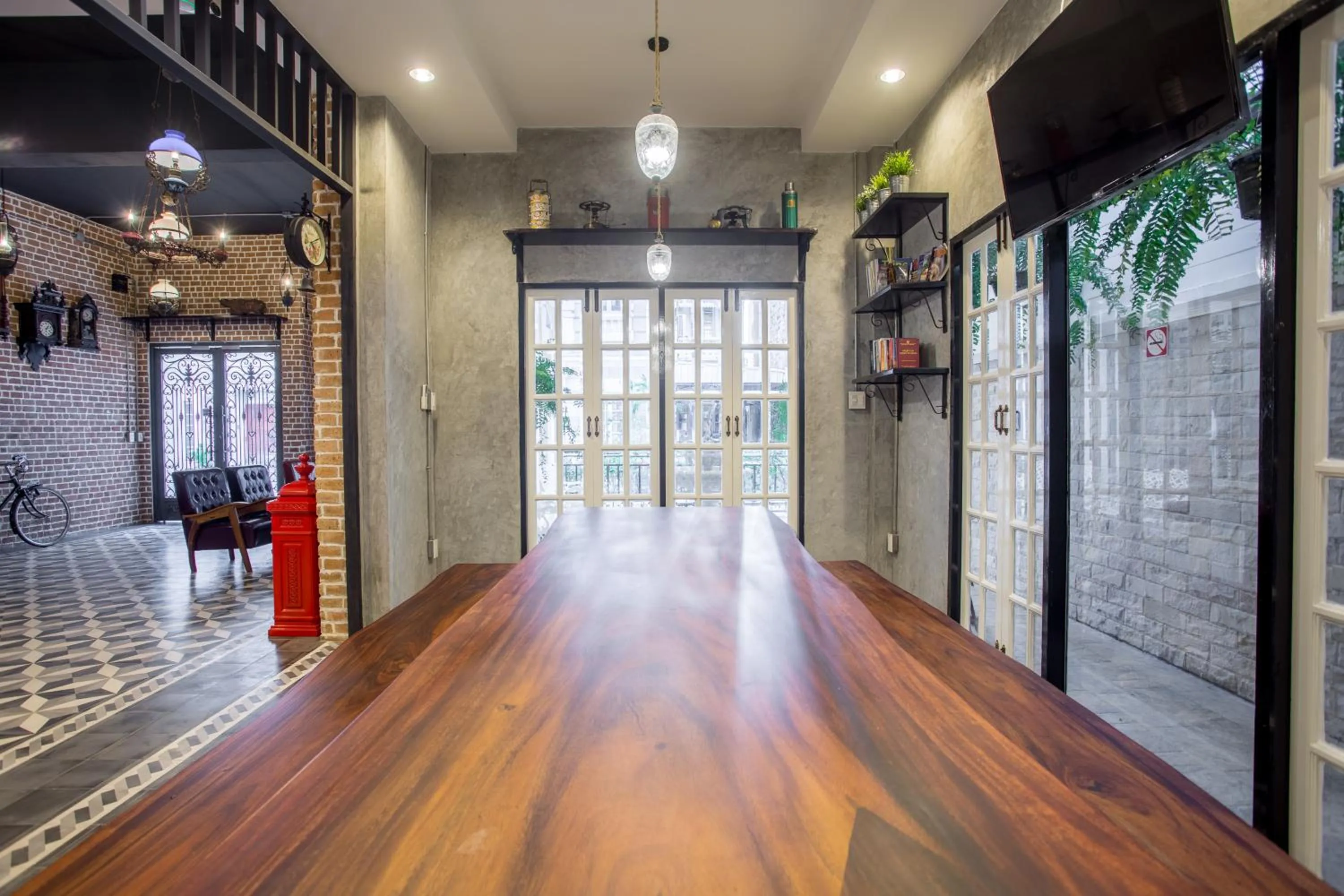 Communal lounge/ TV room in X9Hostel