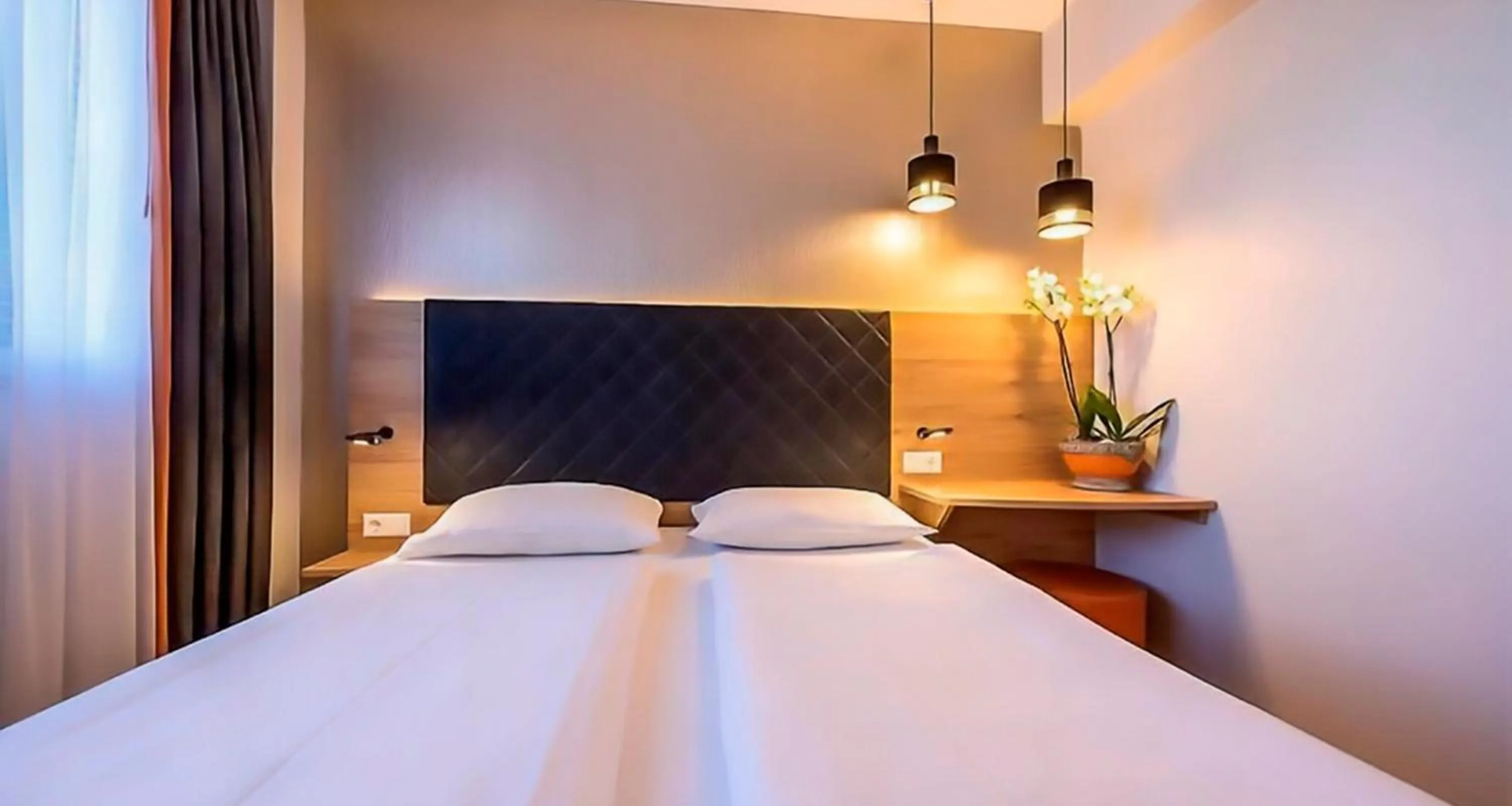 Bed in PLAZA INN Rieker Stuttgart Hauptbahnhof