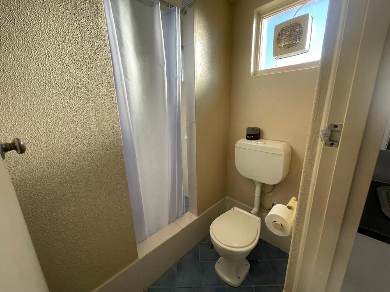 Toilet in Astor Hotel Motel