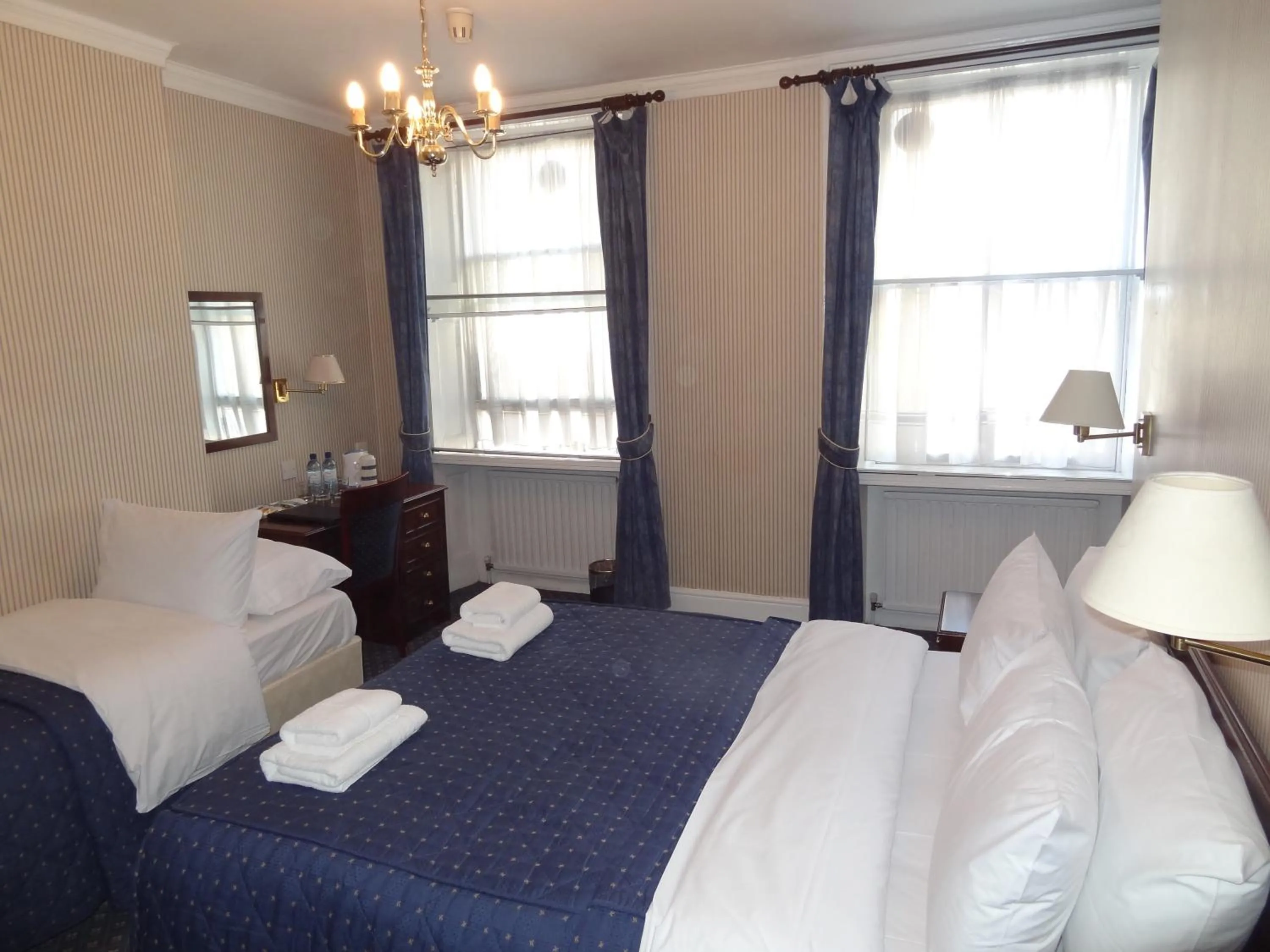 Bed in Regency House Hotel