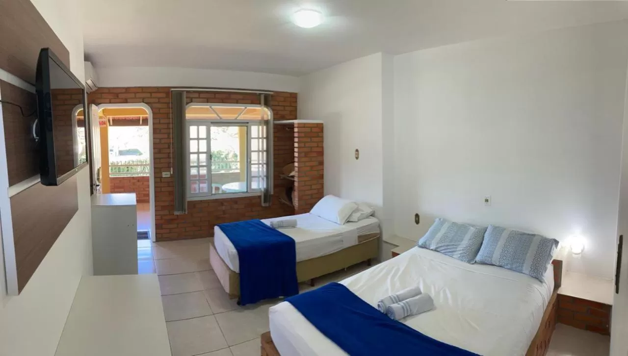 Bed in Pousada Marinamarela