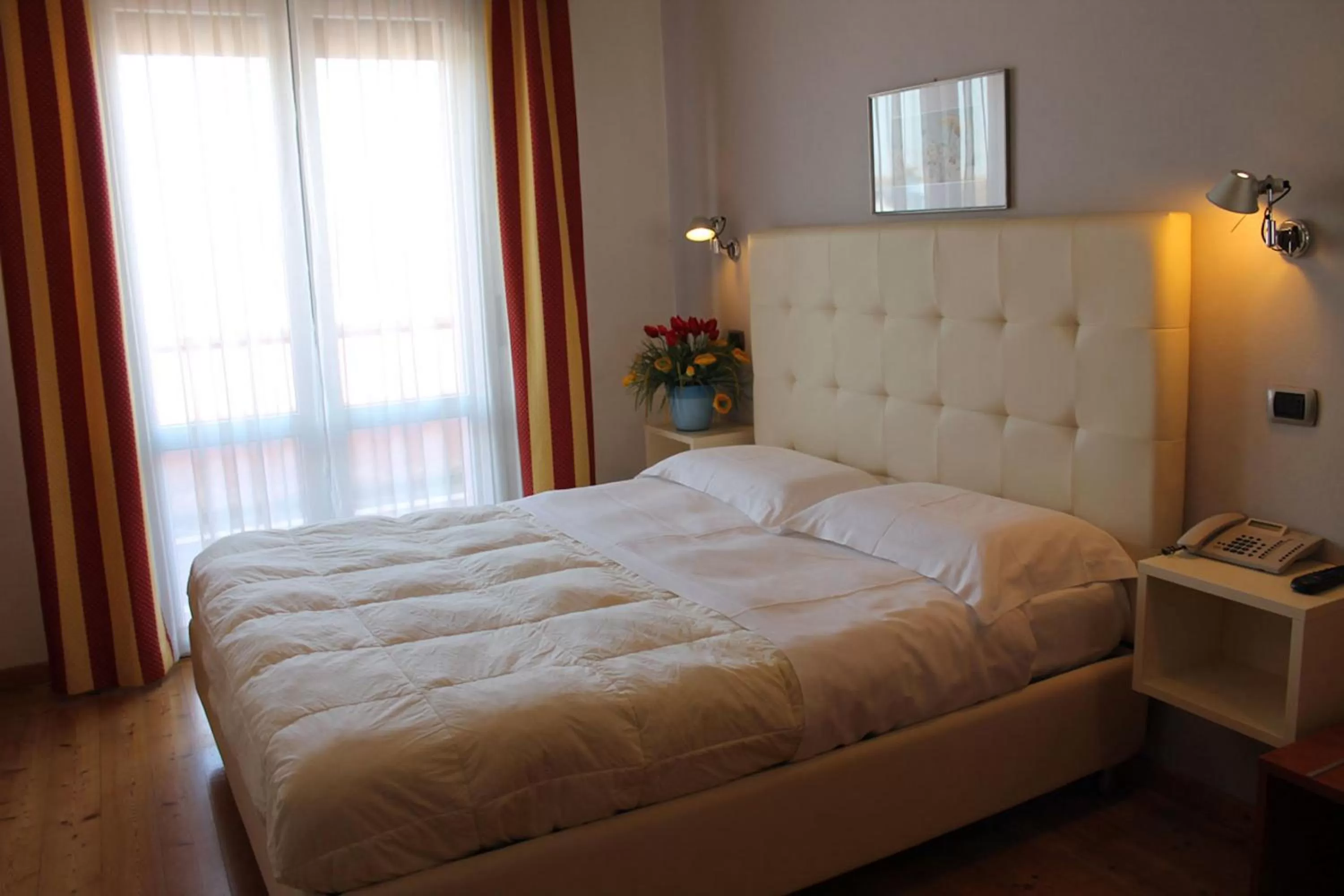 Bed in Hotel Rubicone