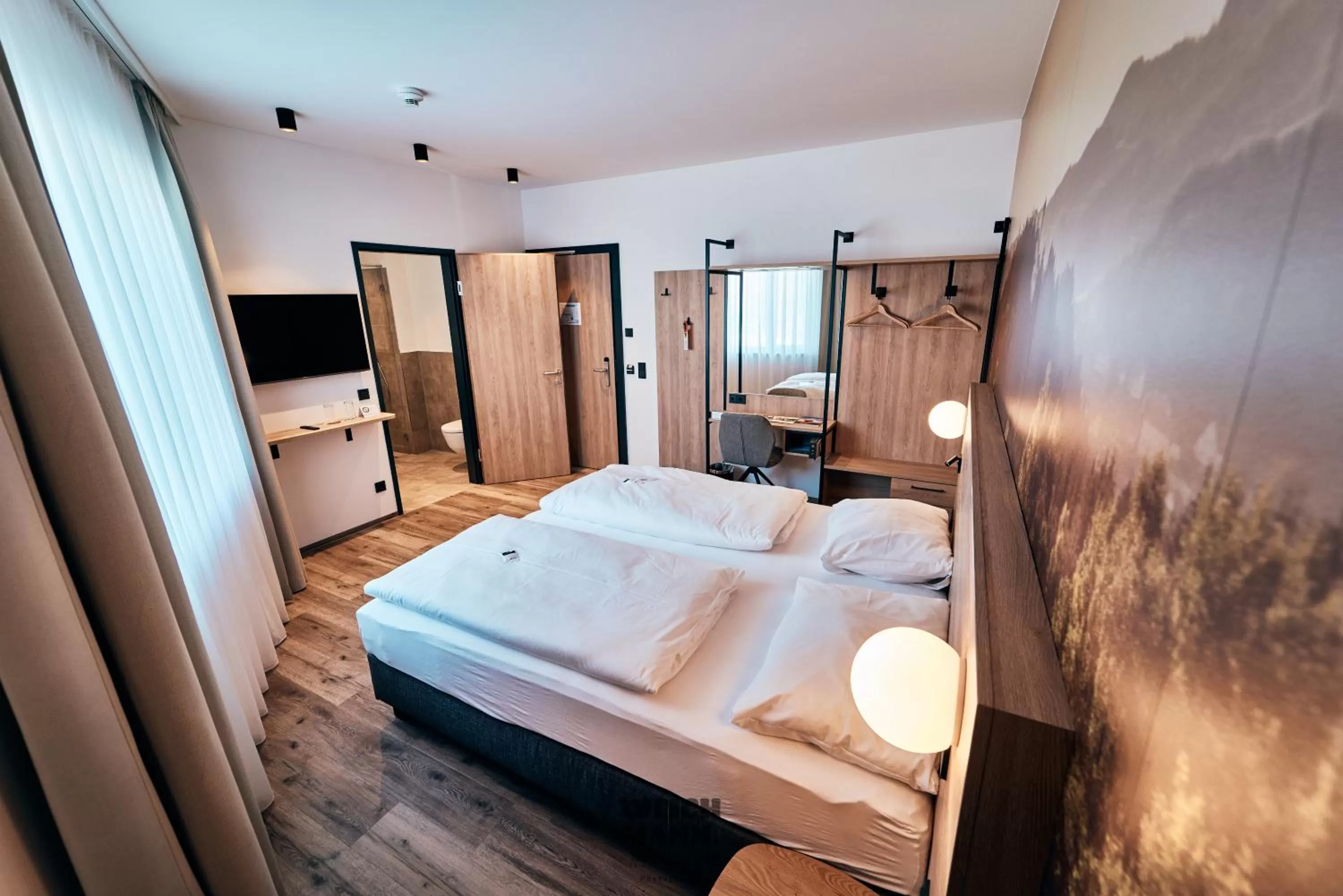 Bed in I'M INN Zwettl - Hotel zum Brauhaus