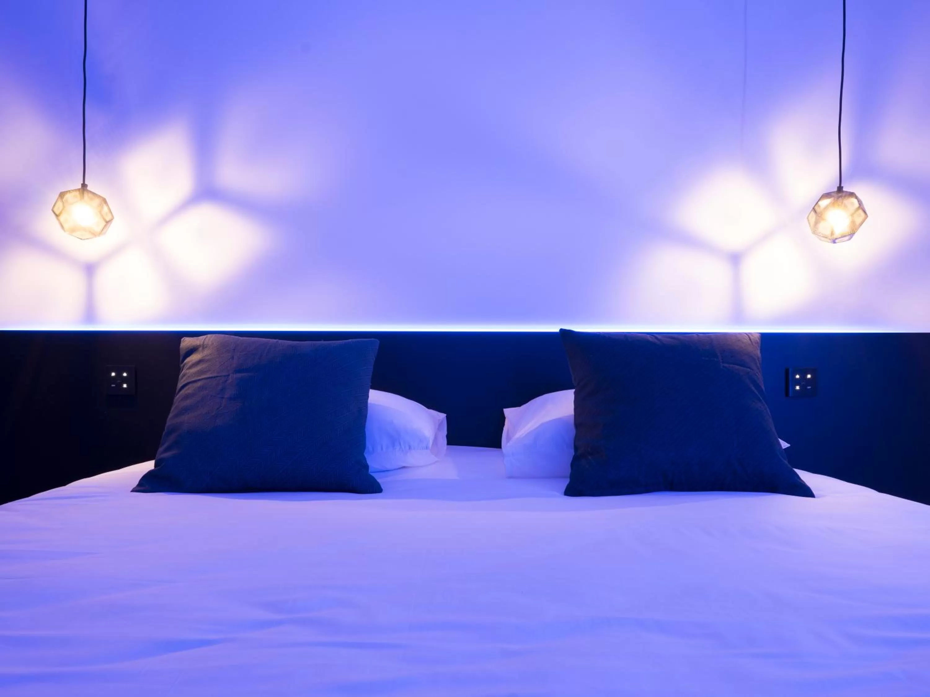 Bed in MiHotel Vieux Lyon