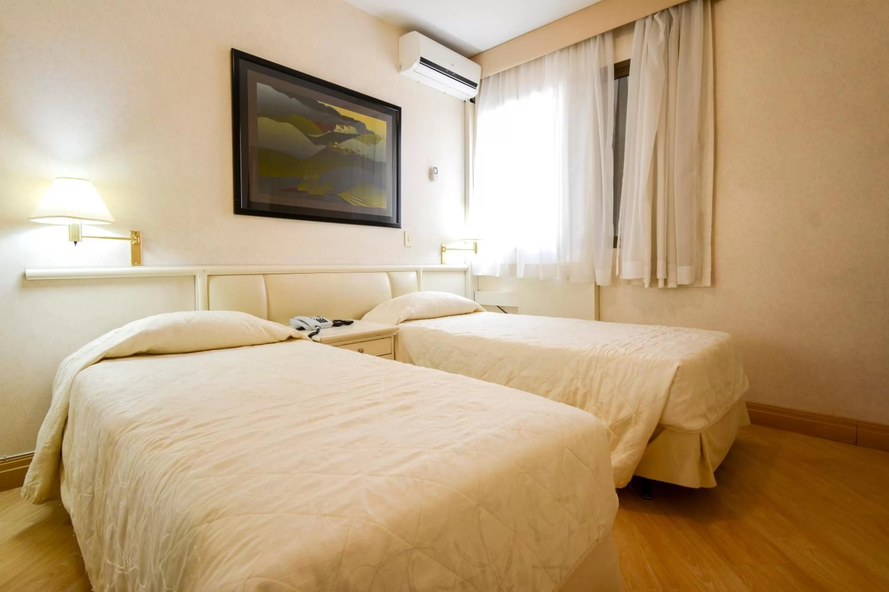 Bed in Wall Street Apartments by BnbHost