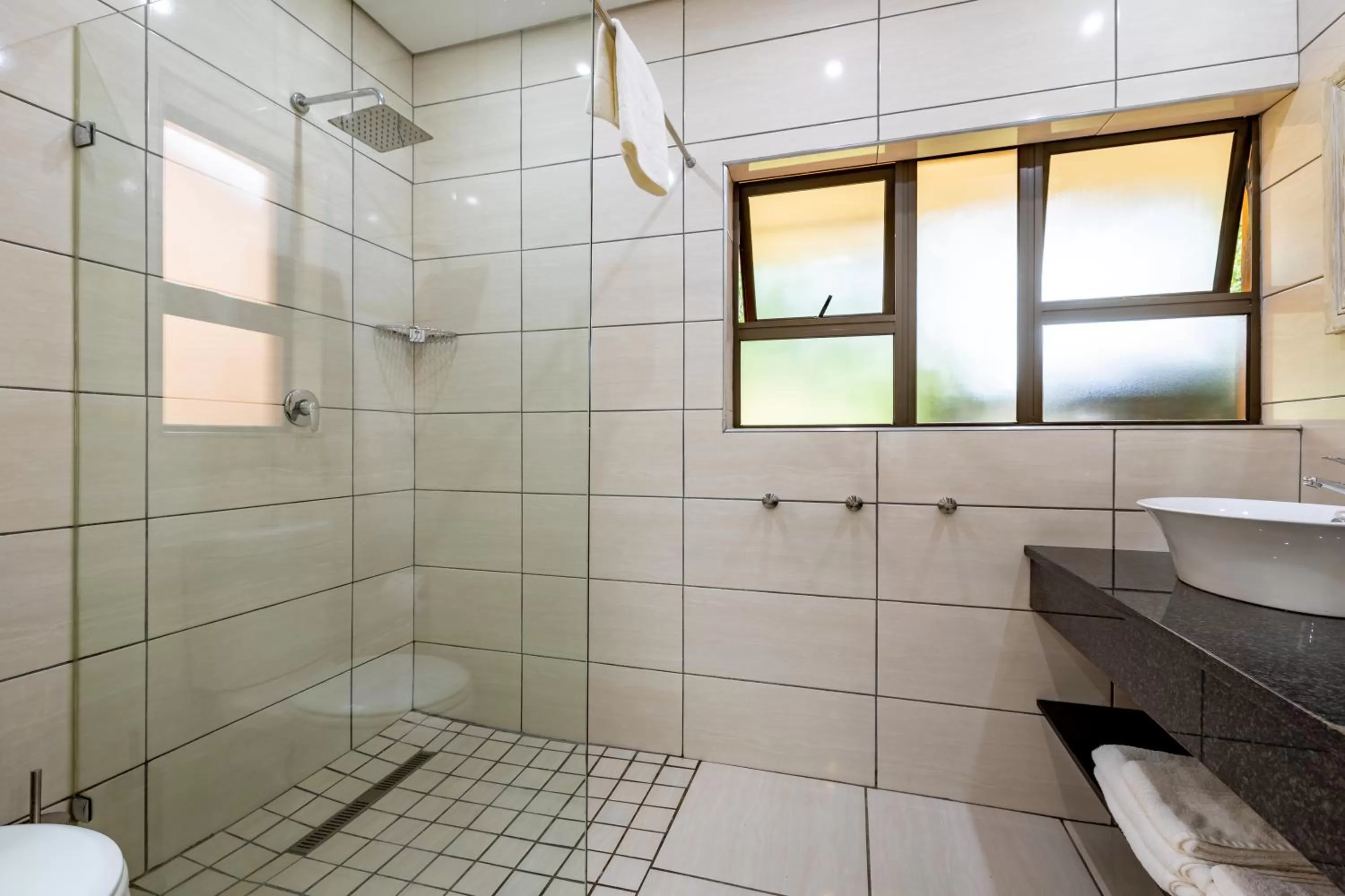 Bathroom in African Sky Hotels - Pine Lake Inn